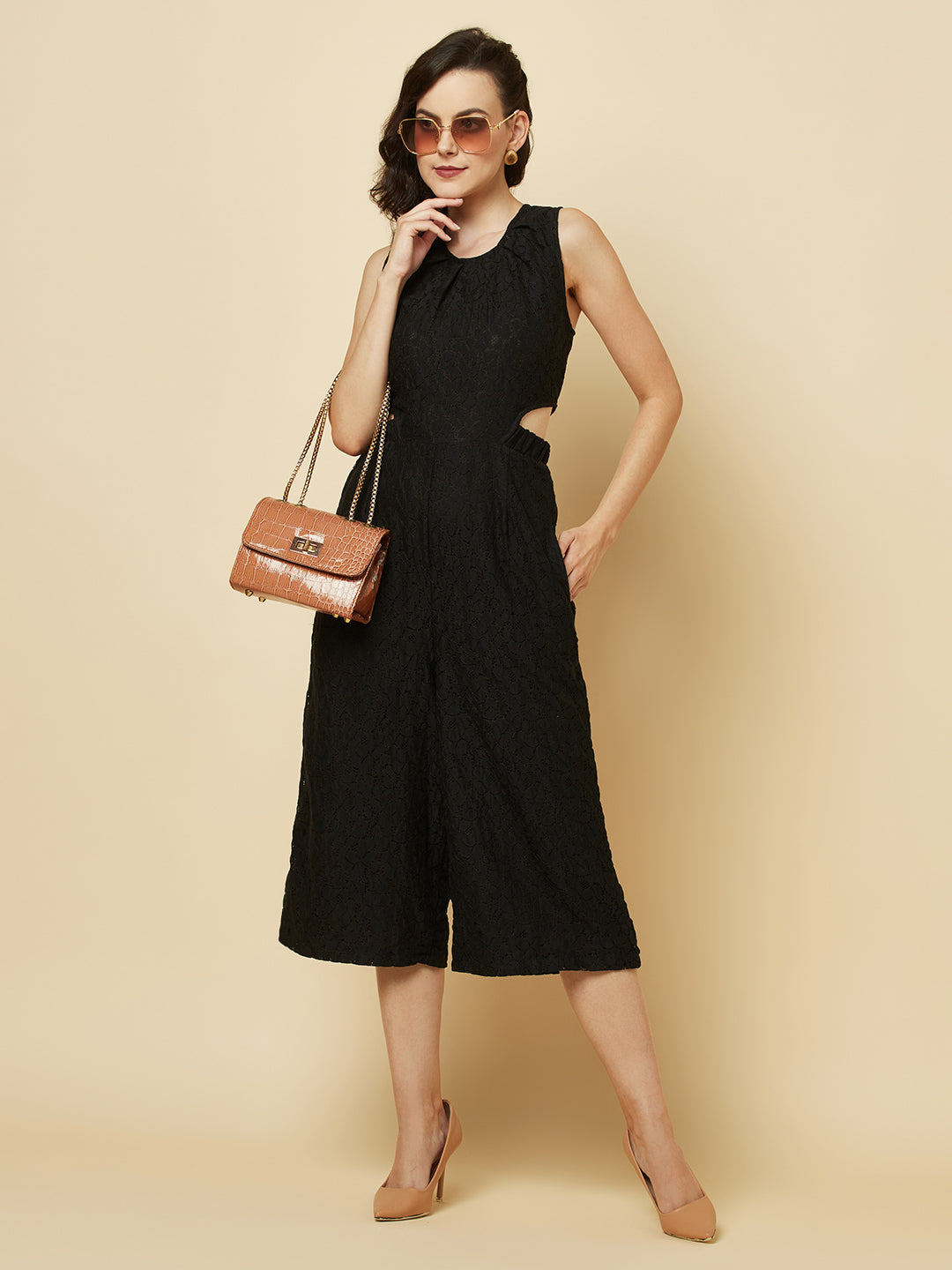 The Black Floral Mesh Side Waist Cut Jumpsuit for Women is a stylish and elegant outfit that features a vibrant black floral pattern and mesh detailing on the sides. This jumpsuit for women is designed to accentuate the waistline with a flattering cut, making it a great choice for any formal occasion or dressy event. It is comfortable to wear and made from high-quality materials, ensuring both style and comfort.