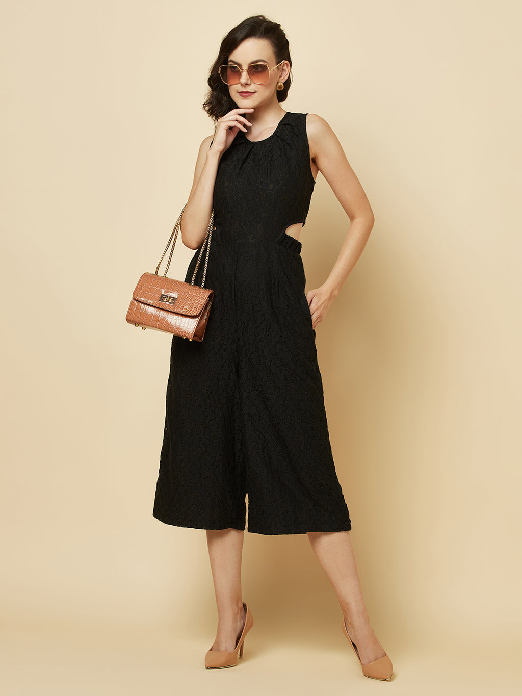 The Black Floral Mesh Side Waist Cut Jumpsuit for Women is a stylish and elegant outfit that features a vibrant black floral pattern and mesh detailing on the sides. This jumpsuit for women is designed to accentuate the waistline with a flattering cut, making it a great choice for any formal occasion or dressy event. It is comfortable to wear and made from high-quality materials, ensuring both style and comfort.