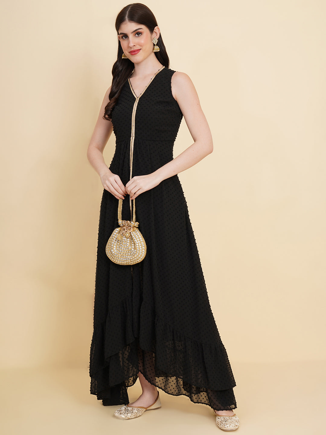 Black  colour long dress for women in georgette. Tailored with V-neck and high low pattern. Finished with a zip closure. It comes with a attached lining.