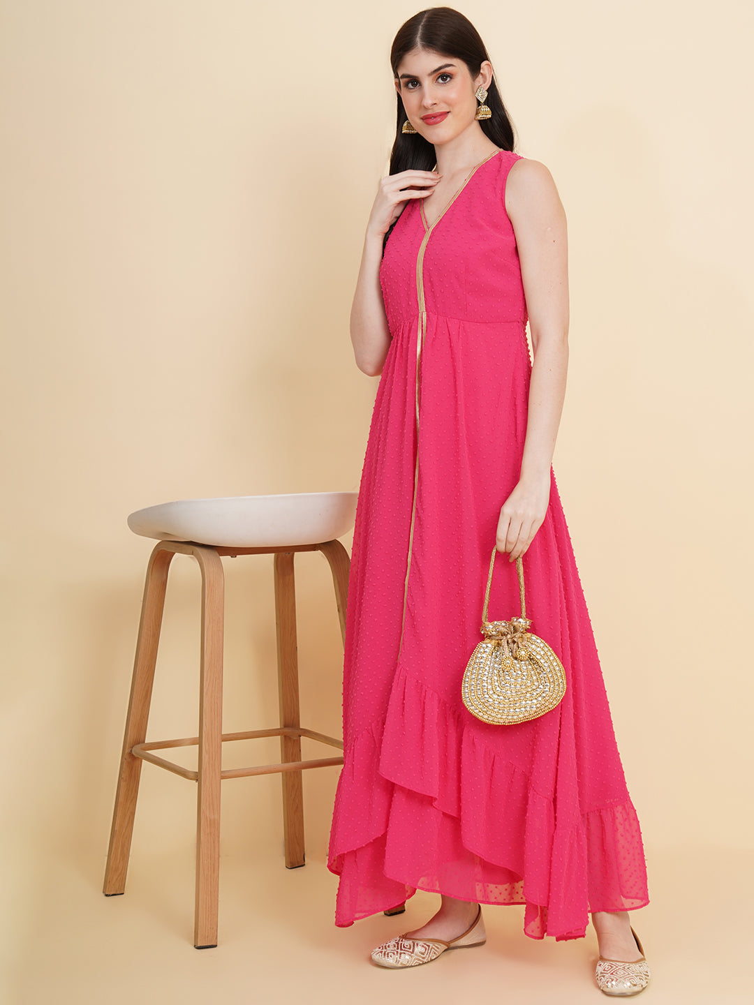 Pink  colour long dress for women in georgette. Tailored with V-neck and high low pattern. Finished with a zip closure. It comes with a attached lining.