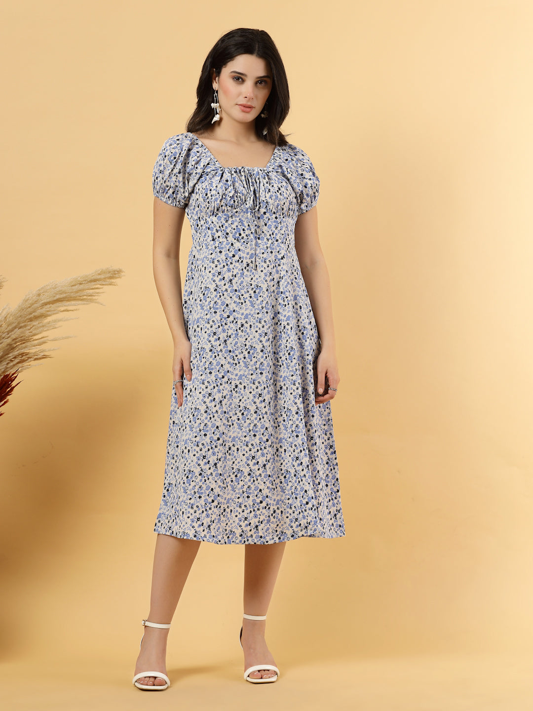 Sunshine in a dress! This flirty A-Line midi boasts a ruched bust, square neck, empire waist, and a flattering front slit – all adorned with gorgeous summer prints. 
Zip Closure at back.