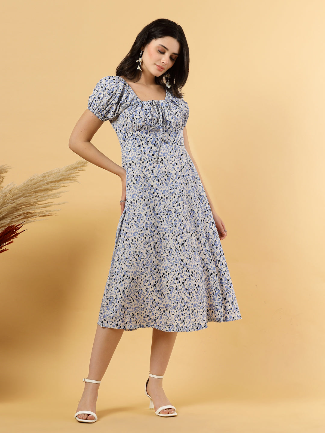 Sunshine in a dress! This flirty A-Line midi boasts a ruched bust, square neck, empire waist, and a flattering front slit – all adorned with gorgeous summer prints. 
Zip Closure at back.