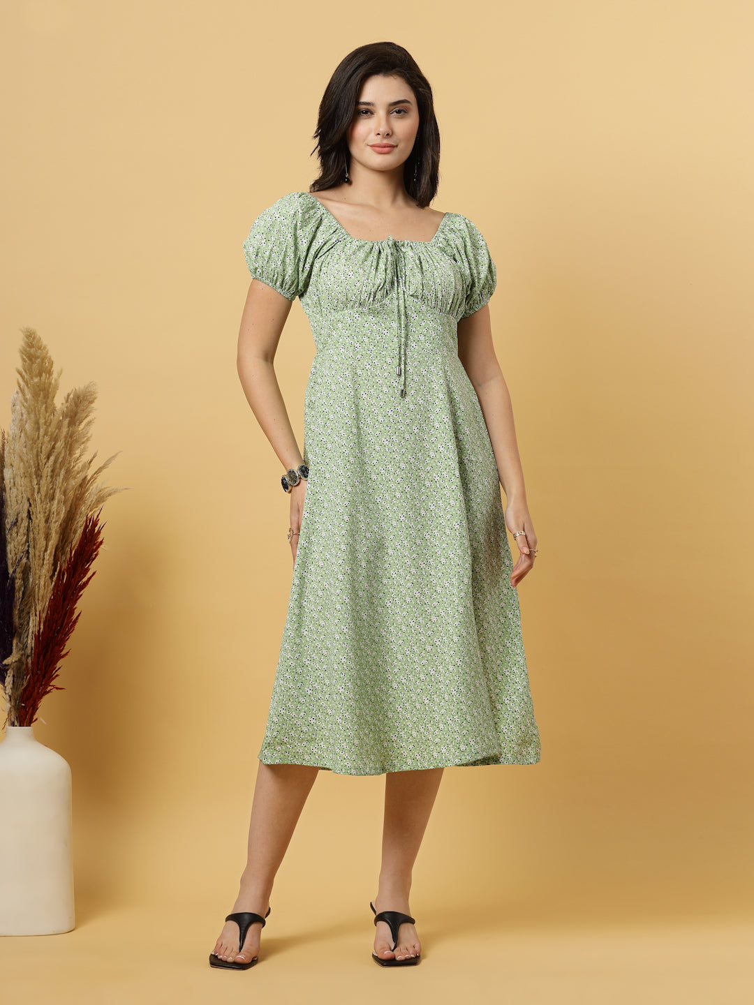Sunshine in a dress! This flirty A-Line midi boasts a ruched bust, square neck, empire waist, and a flattering front slit – all adorned with gorgeous summer prints. 
Zip Closure at back.