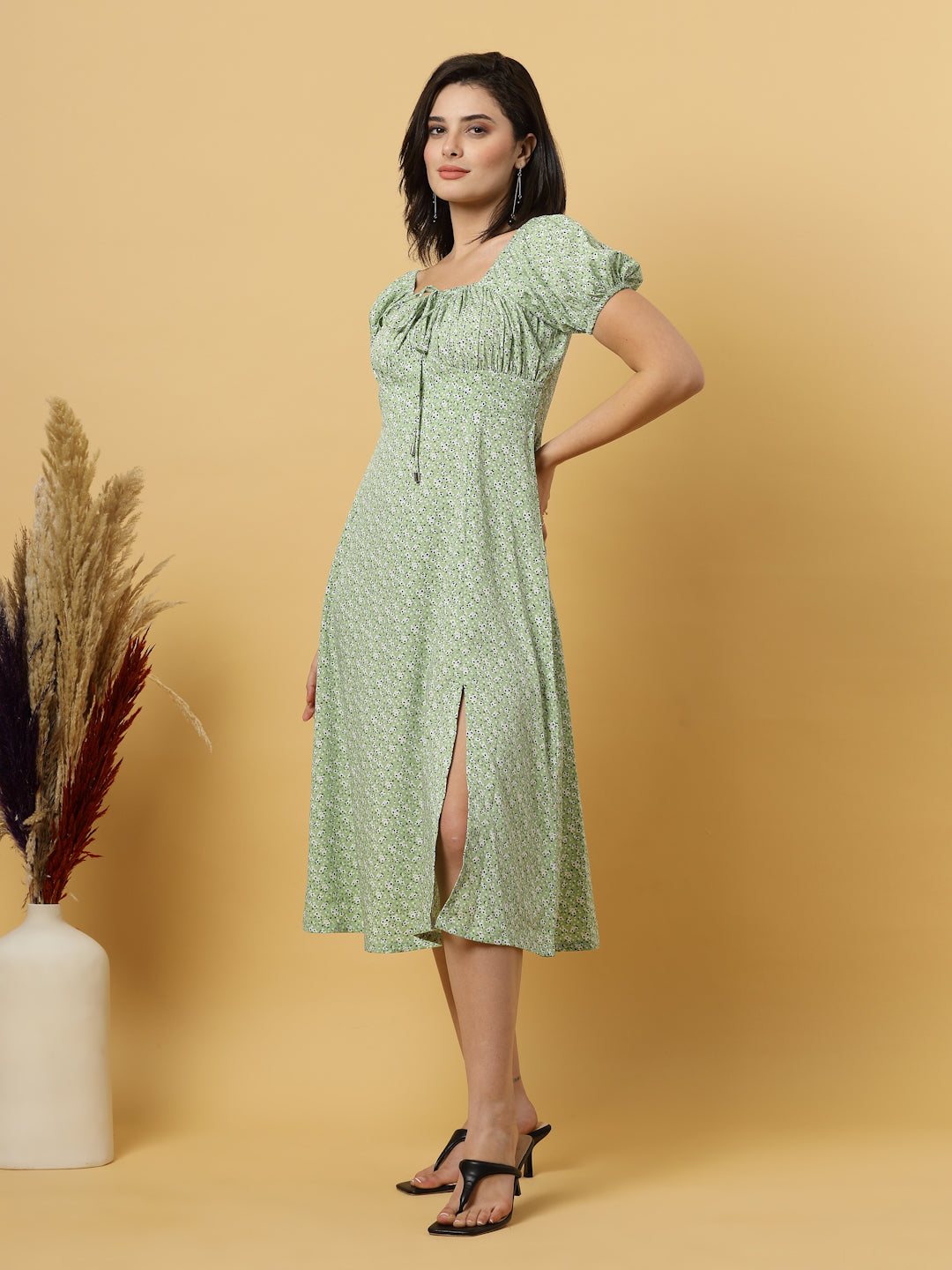 Sunshine in a dress! This flirty A-Line midi boasts a ruched bust, square neck, empire waist, and a flattering front slit – all adorned with gorgeous summer prints. 
Zip Closure at back.
