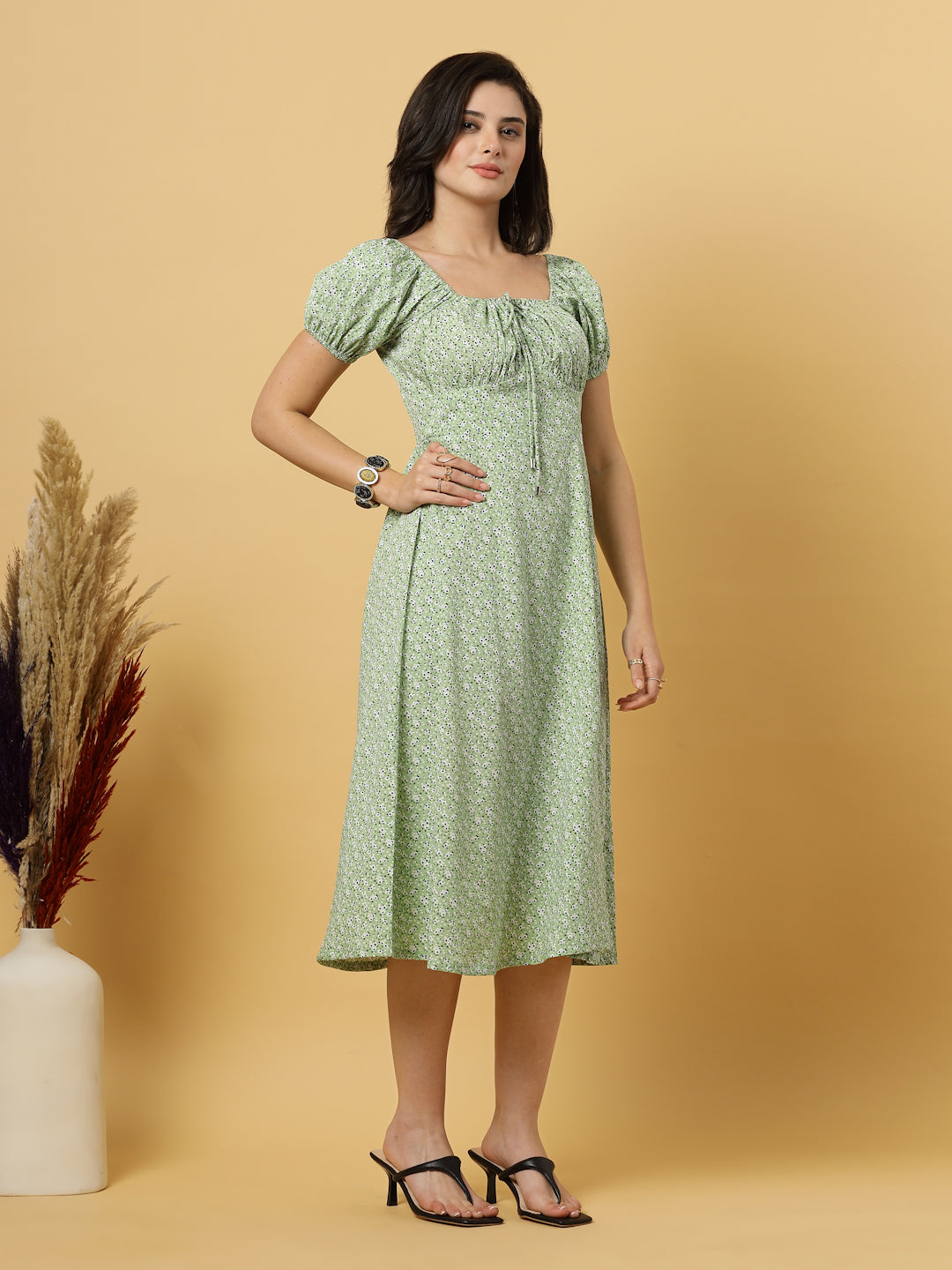 Sunshine in a dress! This flirty A-Line midi boasts a ruched bust, square neck, empire waist, and a flattering front slit – all adorned with gorgeous summer prints. 
Zip Closure at back.
