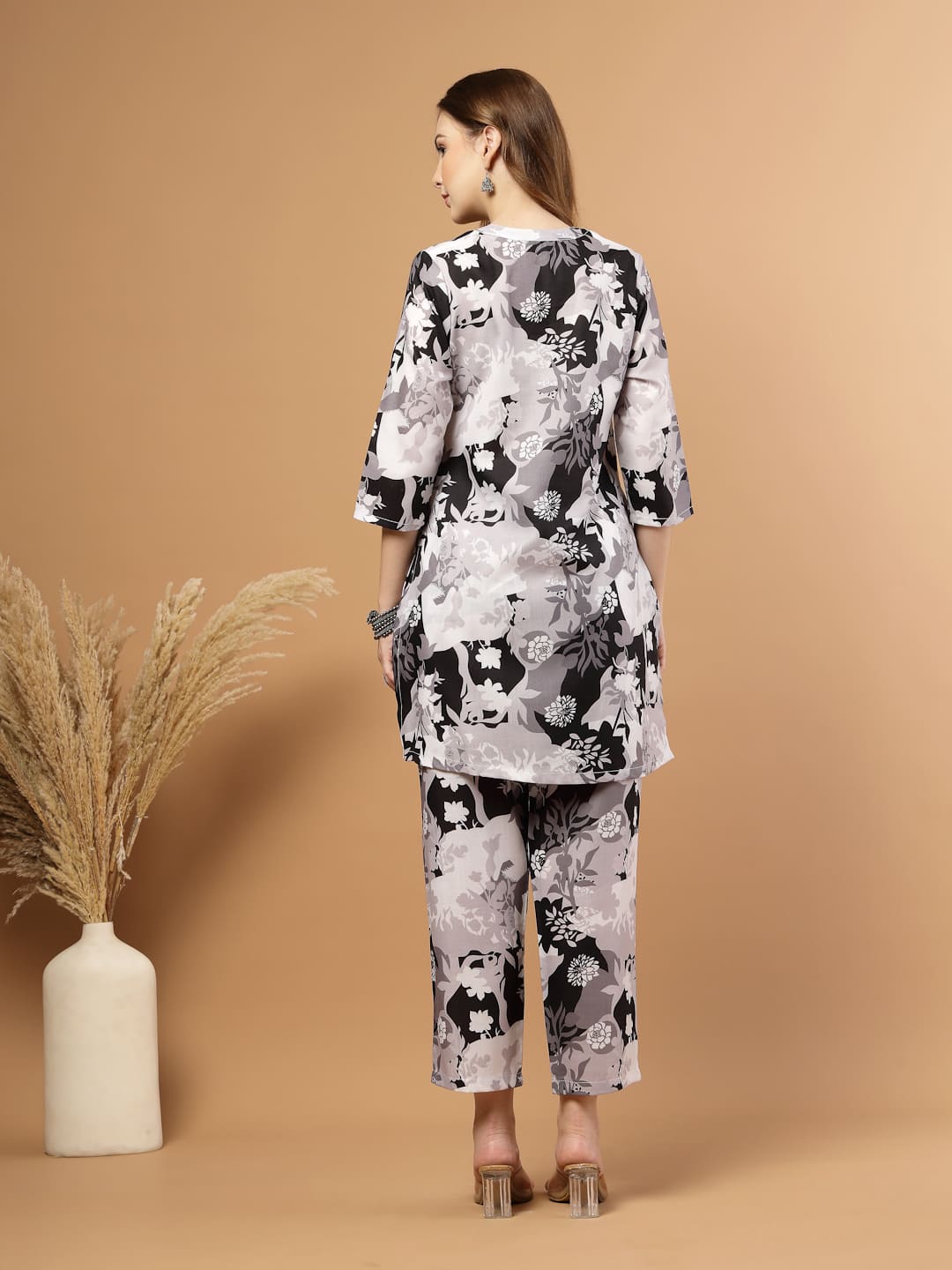 Black and white tropical printed kurta with matching bottoms, featuring soft breathable fabric and coordinated design for casual or festive wear, back view