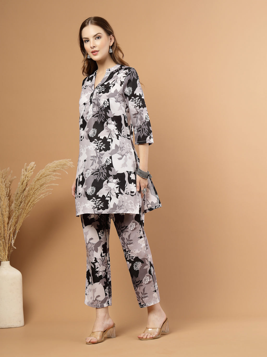 Black and white tropical printed kurta with matching bottoms, featuring soft breathable fabric and coordinated design for casual or festive wear.