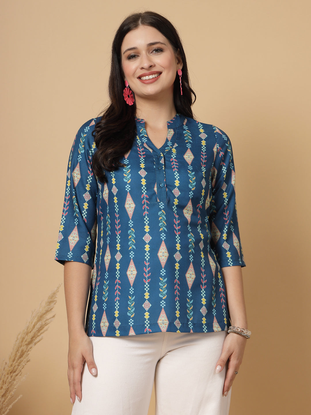A modern take on a classic. This hip-length Printed kurta top offers a band collar, button-front, and a breezy, loose silhouette. Perfect, for office &amp; casual outings.

Dress it up or down for any occasion.
