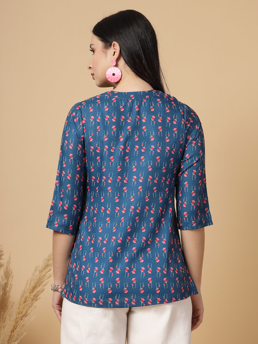 A modern take on a classic. This hip-length Printed kurta top offers a band collar, button-front, and a breezy, loose silhouette. Perfect, for office &amp; casual outings.

Dress it up or down for any occasion.
