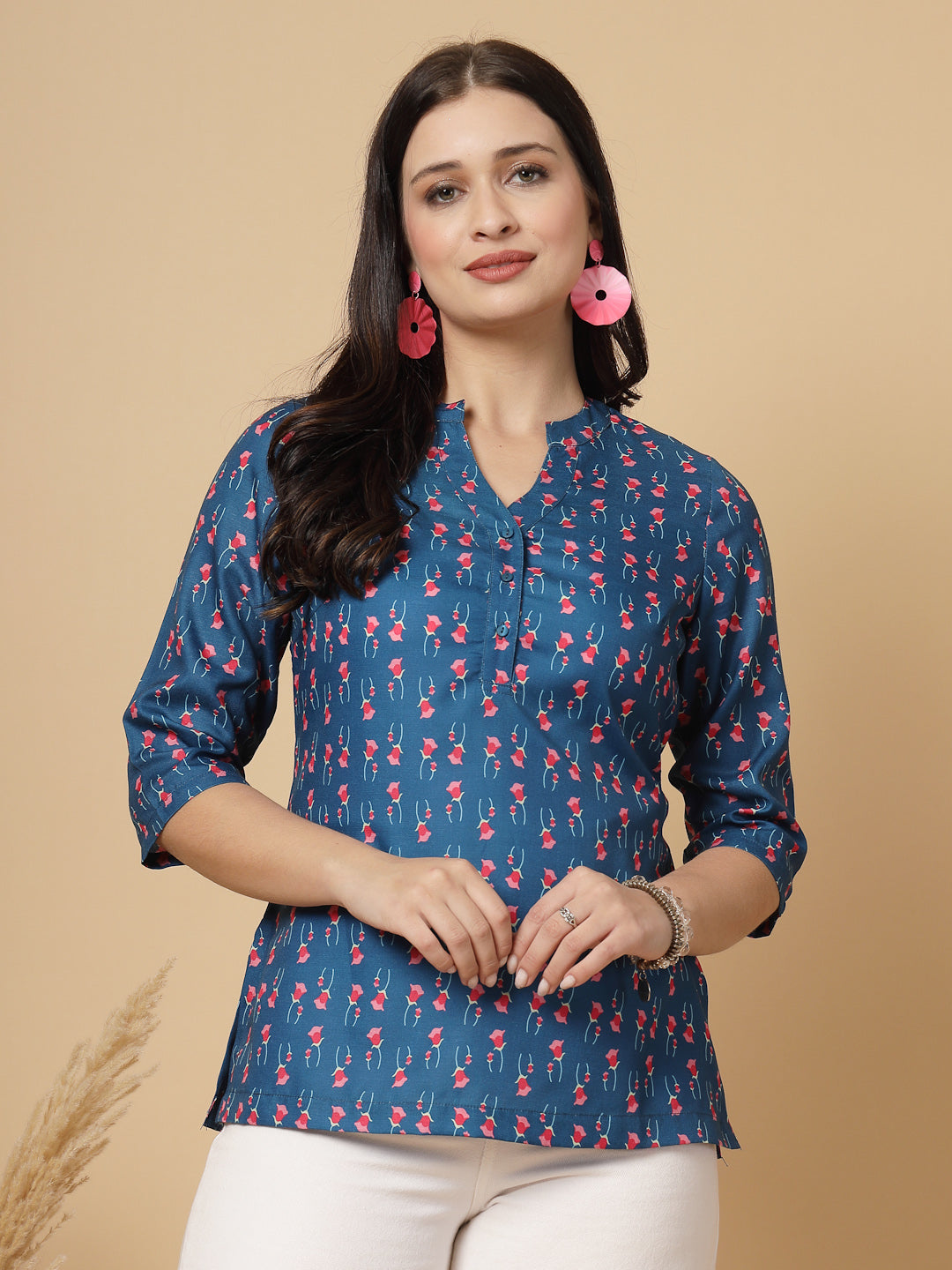 A modern take on a classic. This hip-length Printed kurta top offers a band collar, button-front, and a breezy, loose silhouette. Perfect, for office &amp; casual outings.

Dress it up or down for any occasion.
