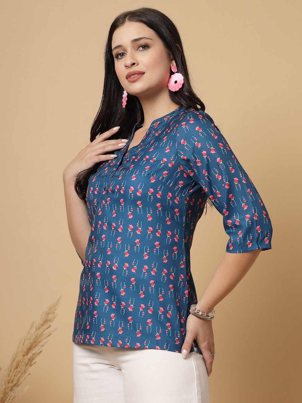 A modern take on a classic. This hip-length Printed kurta top offers a band collar, button-front, and a breezy, loose silhouette. Perfect, for office &amp; casual outings.

Dress it up or down for any occasion.
