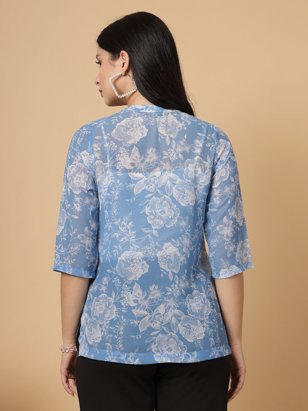 A modern take on a classic. This hip-length Printed kurta top offers a band collar, button-front, and a breezy, loose silhouette. Perfect, for office &amp; casual outings.

Dress it up or down for any occasion.
