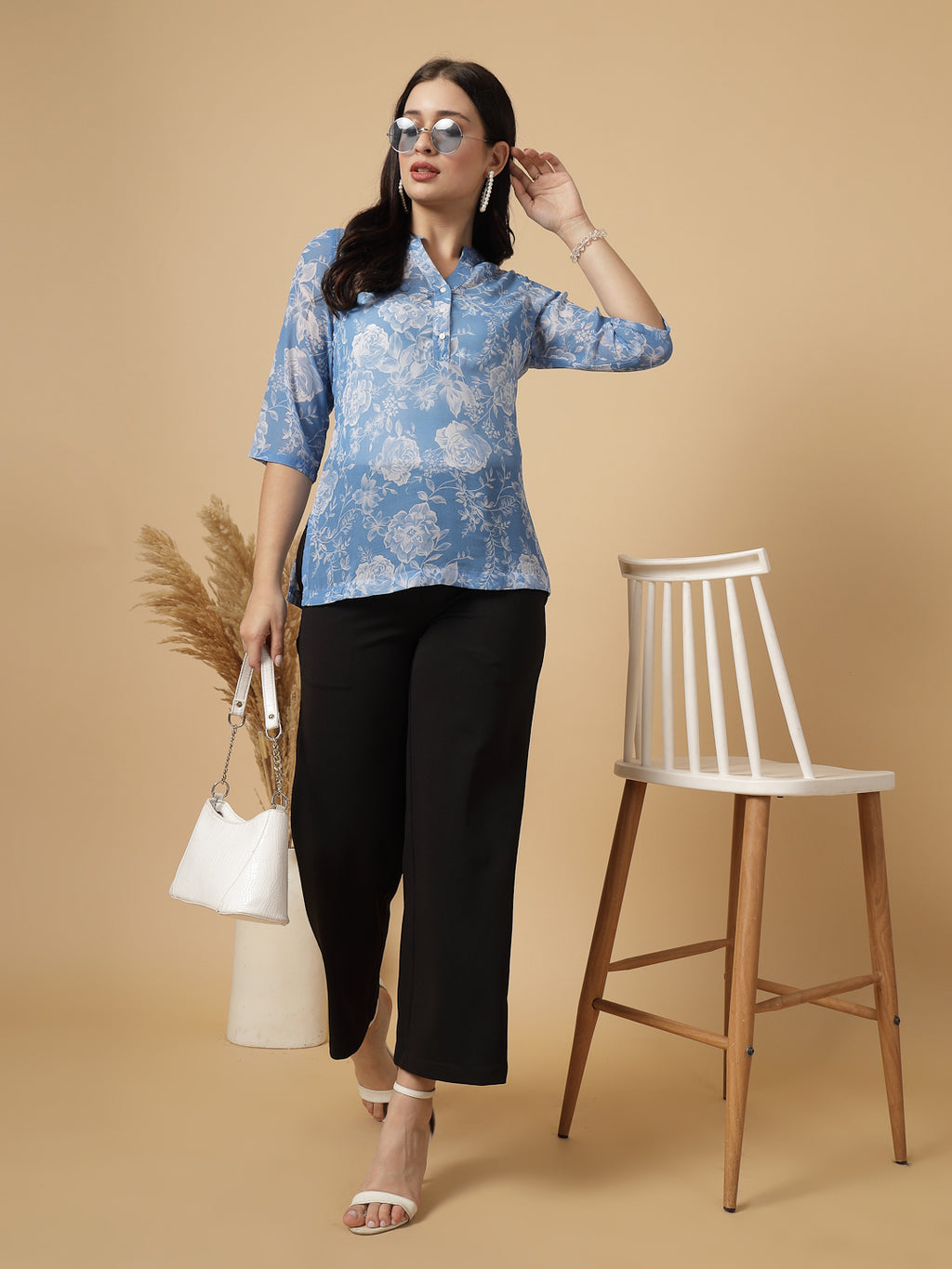 A modern take on a classic. This hip-length Printed kurta top offers a band collar, button-front, and a breezy, loose silhouette. Perfect, for office &amp; casual outings.

Dress it up or down for any occasion.
