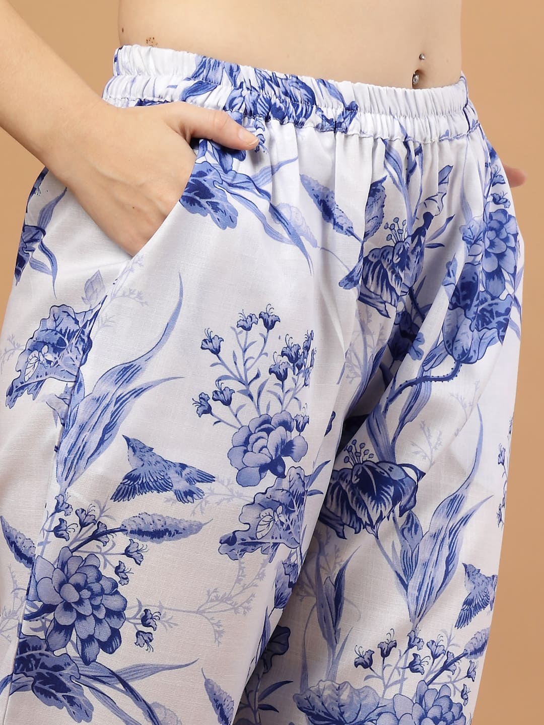 Close up image of blue Toile Print Bottom with elasticated waist & 2 side pockets worn by a women