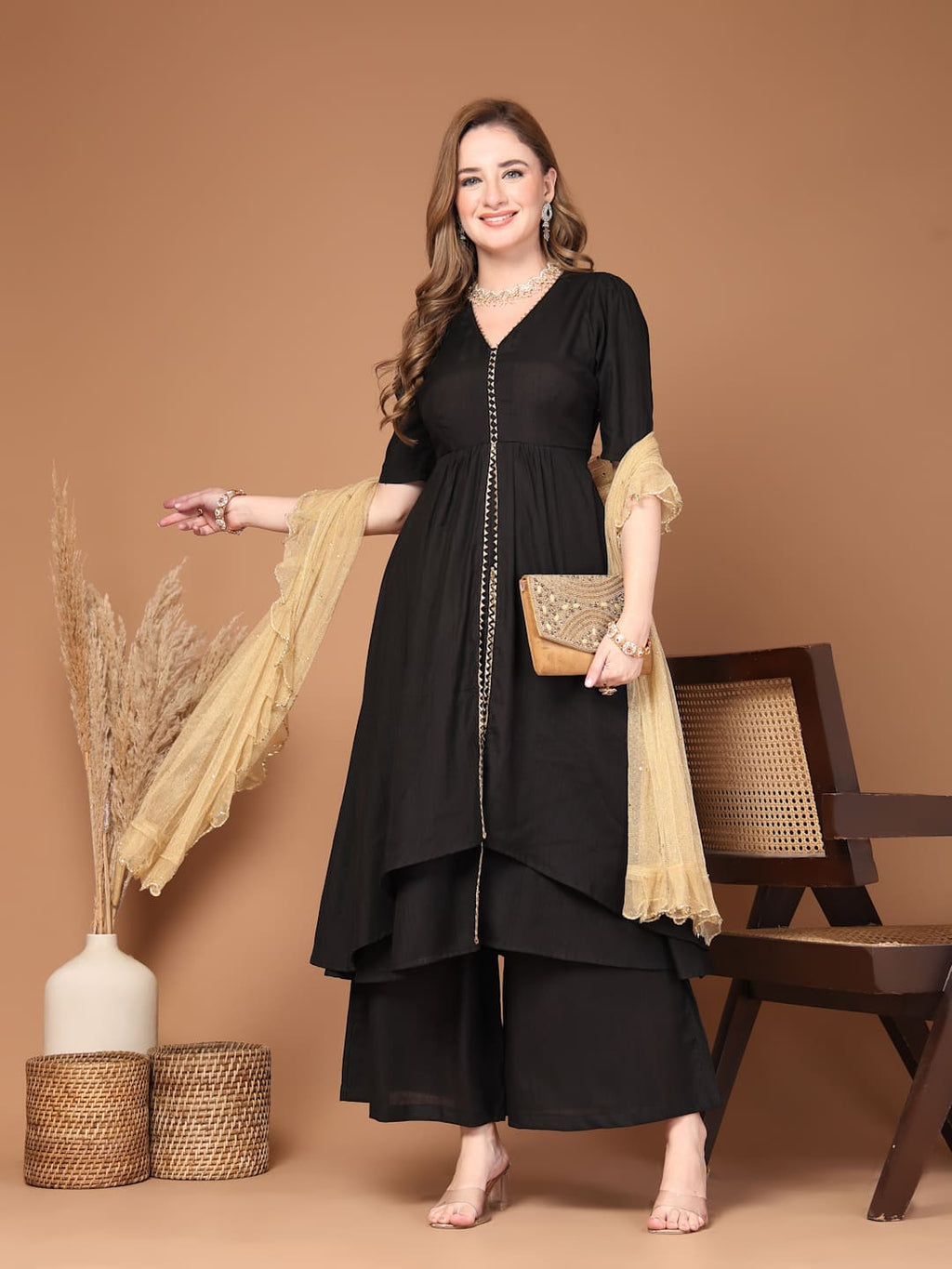 Women’s black layered kurta set with flared pants featuring a stylish silhouette, perfect for festive celebrations, parties and everyday ethnic wear- Front View