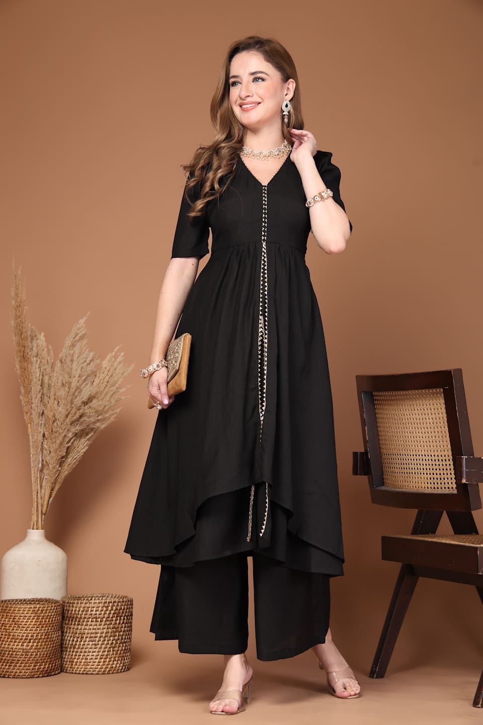 Women’s black layered kurta set with flared pants featuring a stylish silhouette, perfect for festive celebrations, parties and everyday ethnic wear- Front View 2