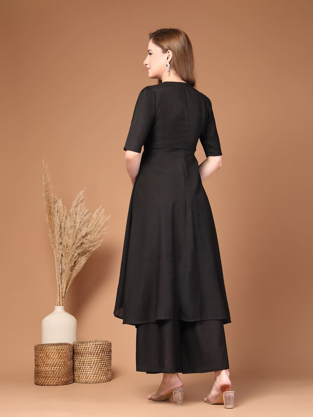 Women’s black layered kurta set with flared pants featuring a stylish silhouette, perfect for festive celebrations, parties and everyday ethnic wear-Back View