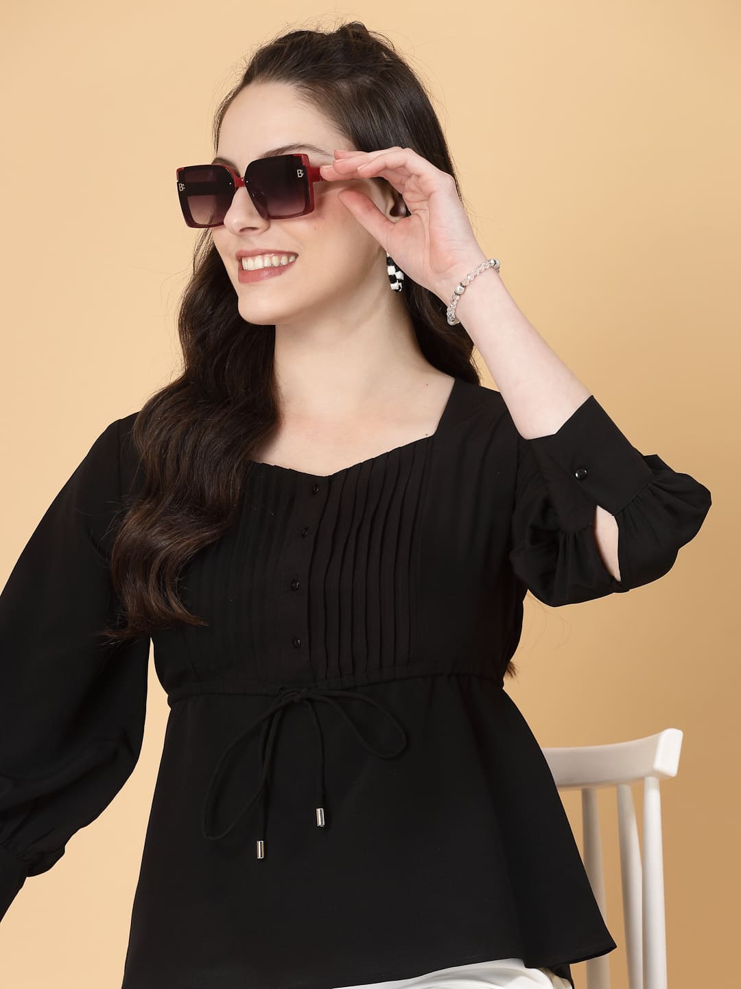 Effortlessly chic. Work-ready. This solid blouse with pintuck detail adds a touch of polish to your Formal outfit. Cuffed sleeves, drawstring waist, and pintuck charm. Dress it up or down this blouse does it all.
Solid color, pintuck detail, and a touch of cinch. Your new Formal blouse For Work.