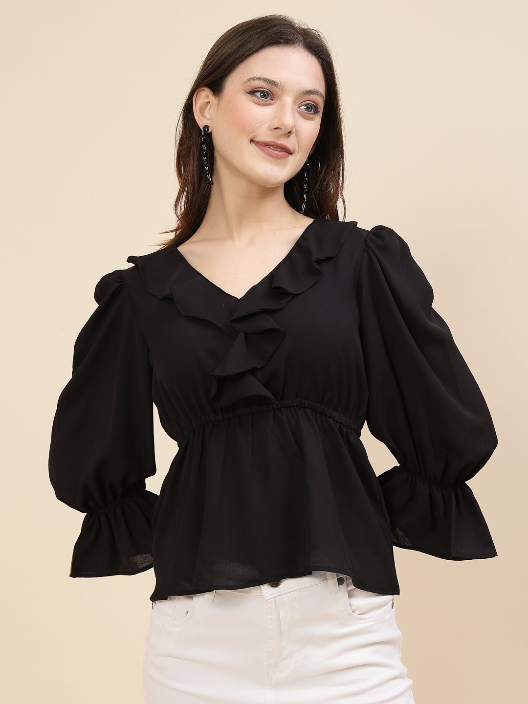 Black colour chic and sophisticated stylish top for women is a perfect blend of contemporary elegance and timeless charm. This exquisite piece features a beautifully ruffled neckline that adds a touch of romance and femininity to your ensemble. The ruched waist not only enhances your silhouette but also adds a modern twist, creating a flattering and fashionable look.