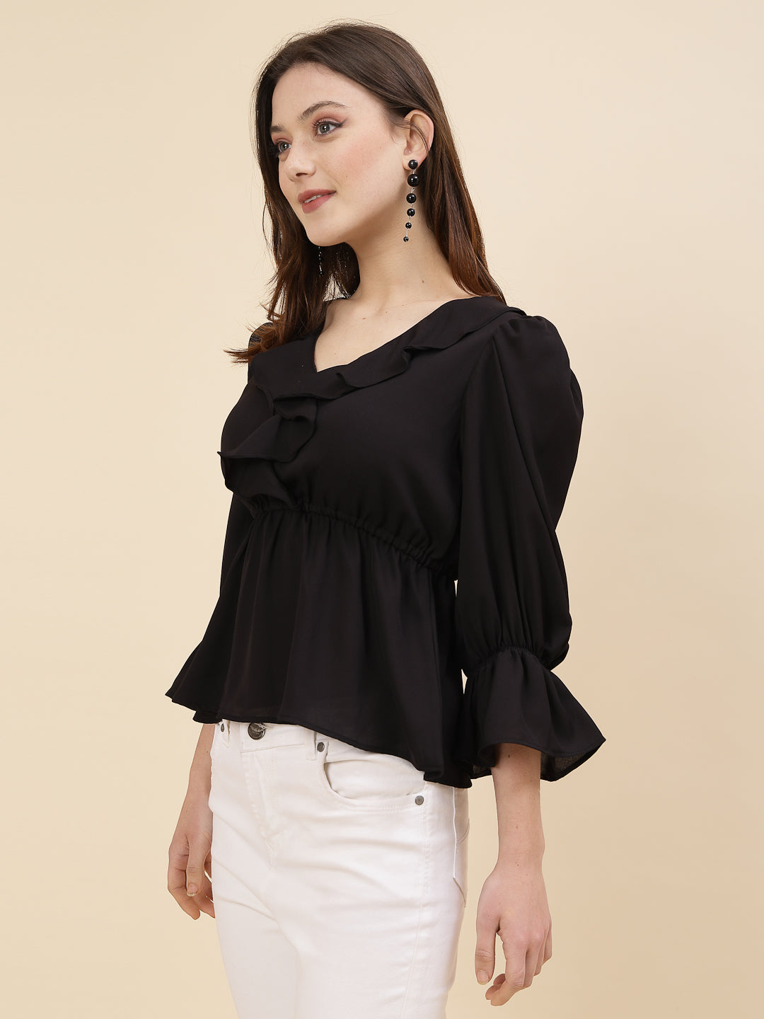 Black colour chic and sophisticated stylish top for women is a perfect blend of contemporary elegance and timeless charm. This exquisite piece features a beautifully ruffled neckline that adds a touch of romance and femininity to your ensemble. The ruched waist not only enhances your silhouette but also adds a modern twist, creating a flattering and fashionable look.