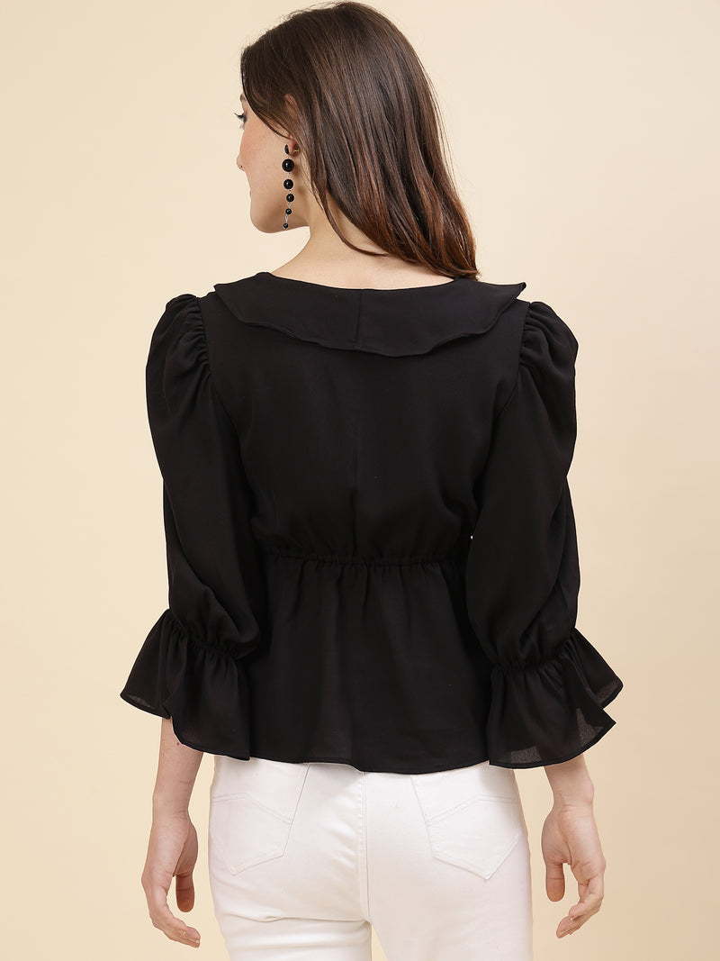 Black colour chic and sophisticated stylish top for women is a perfect blend of contemporary elegance and timeless charm. This exquisite piece features a beautifully ruffled neckline that adds a touch of romance and femininity to your ensemble. The ruched waist not only enhances your silhouette but also adds a modern twist, creating a flattering and fashionable look.