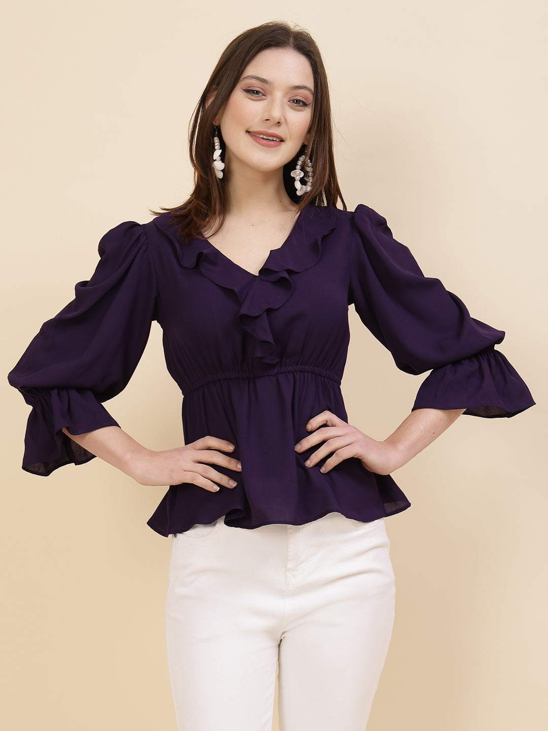Chic and sophisticated stylish top for women is a perfect blend of contemporary elegance and timeless charm. This exquisite piece features a beautifully ruffled neckline that adds a touch of romance and femininity to your ensemble. The ruched waist not only enhances your silhouette but also adds a modern twist, creating a flattering and fashionable look.