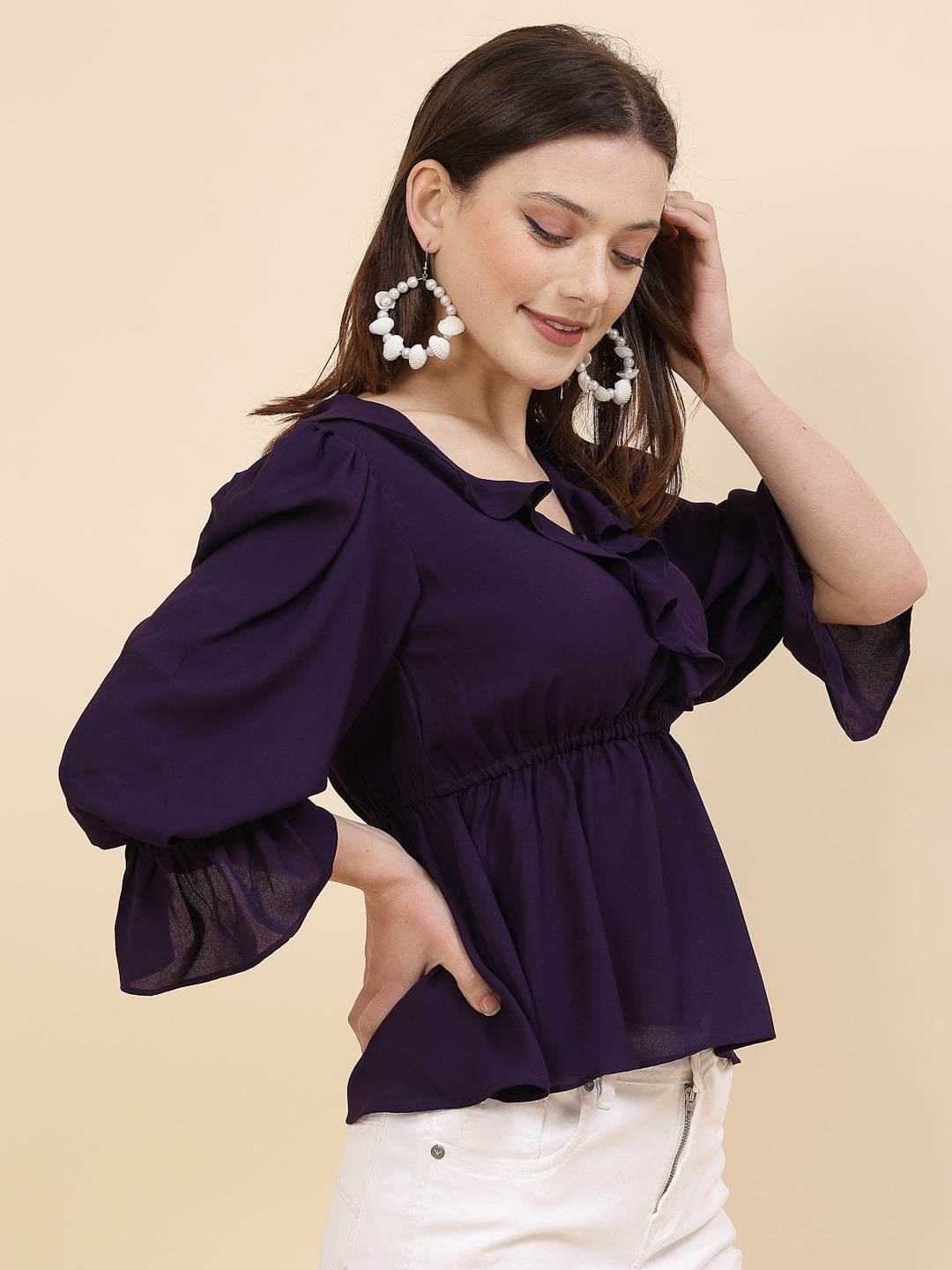 Chic and sophisticated stylish top for women is a perfect blend of contemporary elegance and timeless charm. This exquisite piece features a beautifully ruffled neckline that adds a touch of romance and femininity to your ensemble. The ruched waist not only enhances your silhouette but also adds a modern twist, creating a flattering and fashionable look.