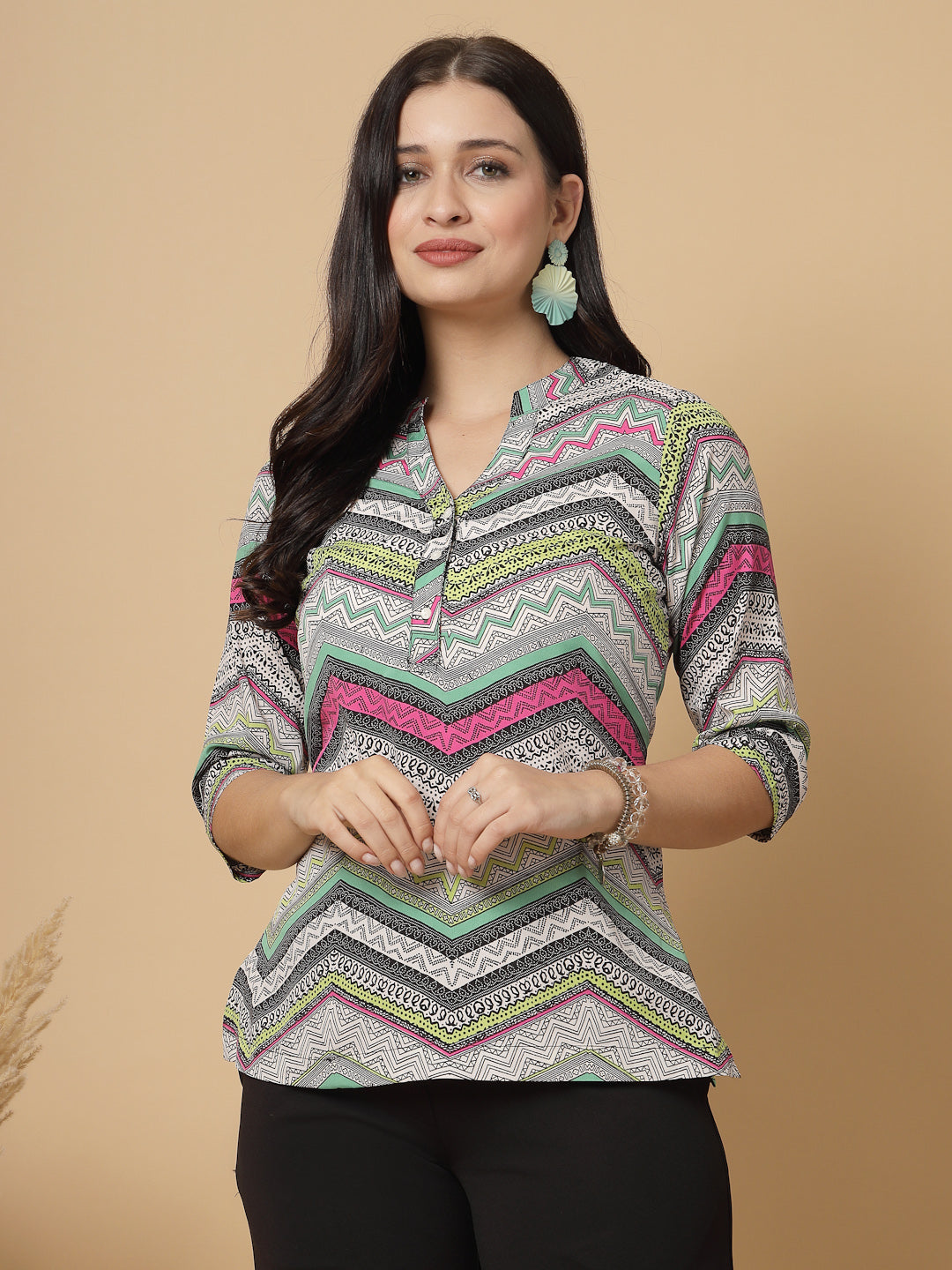 A modern take on a classic. This hip-length Printed kurta top offers a band collar, button-front, and a breezy, loose silhouette. Perfect, for office &amp; casual outings.

Dress it up or down for any occasion.
