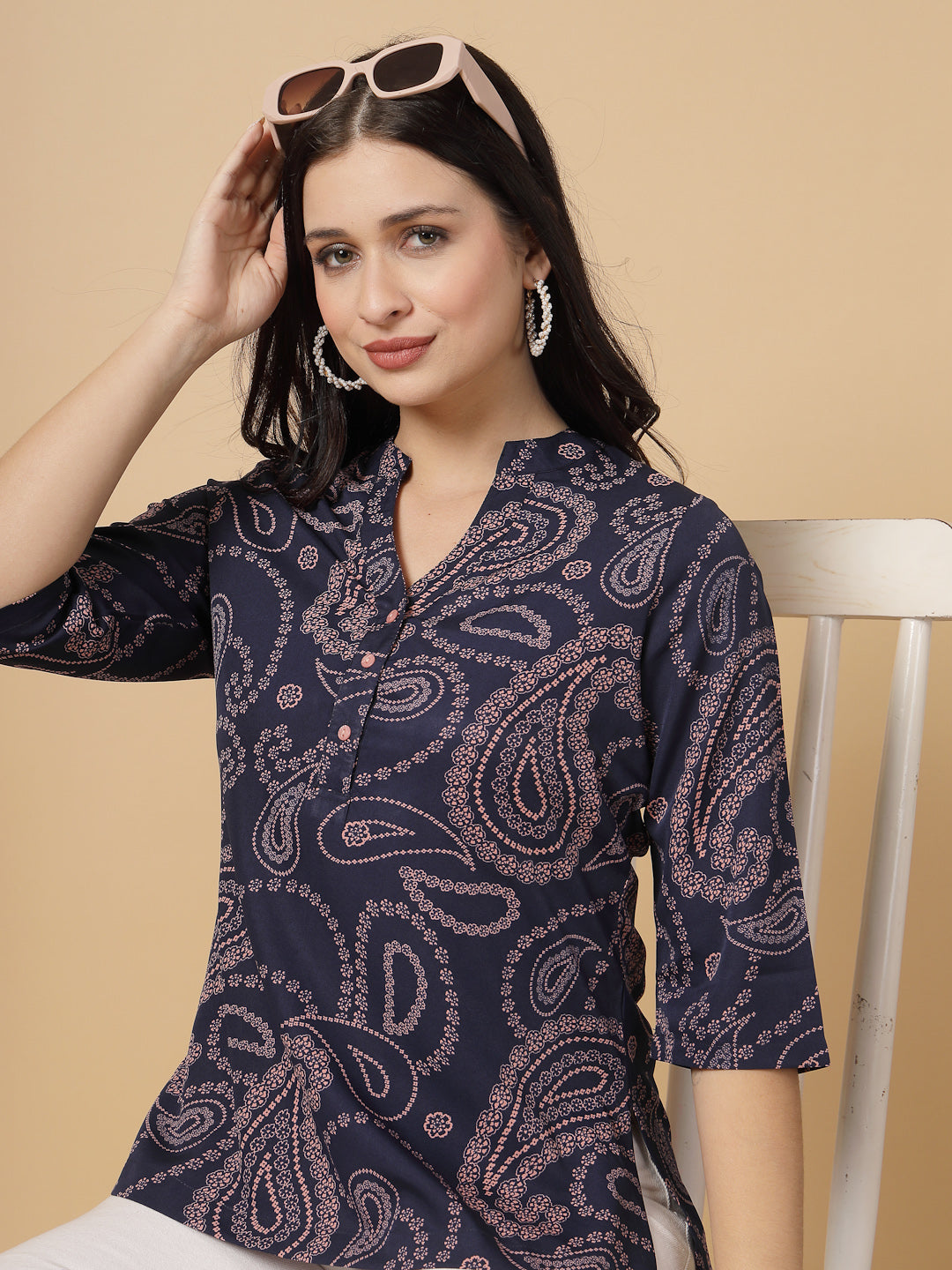 A modern take on a classic. This hip-length Printed kurta top offers a band collar, button-front, and a breezy, loose silhouette. Perfect, for office &amp; casual outings.

Dress it up or down for any occasion.

