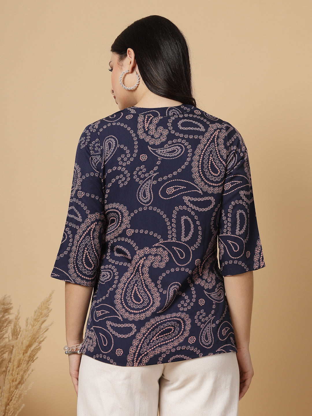 A modern take on a classic. This hip-length Printed kurta top offers a band collar, button-front, and a breezy, loose silhouette. Perfect, for office &amp; casual outings.

Dress it up or down for any occasion.
