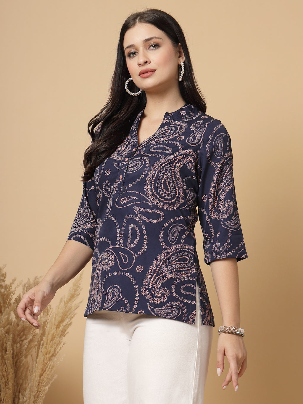 A modern take on a classic. This hip-length Printed kurta top offers a band collar, button-front, and a breezy, loose silhouette. Perfect, for office &amp; casual outings.

Dress it up or down for any occasion.
