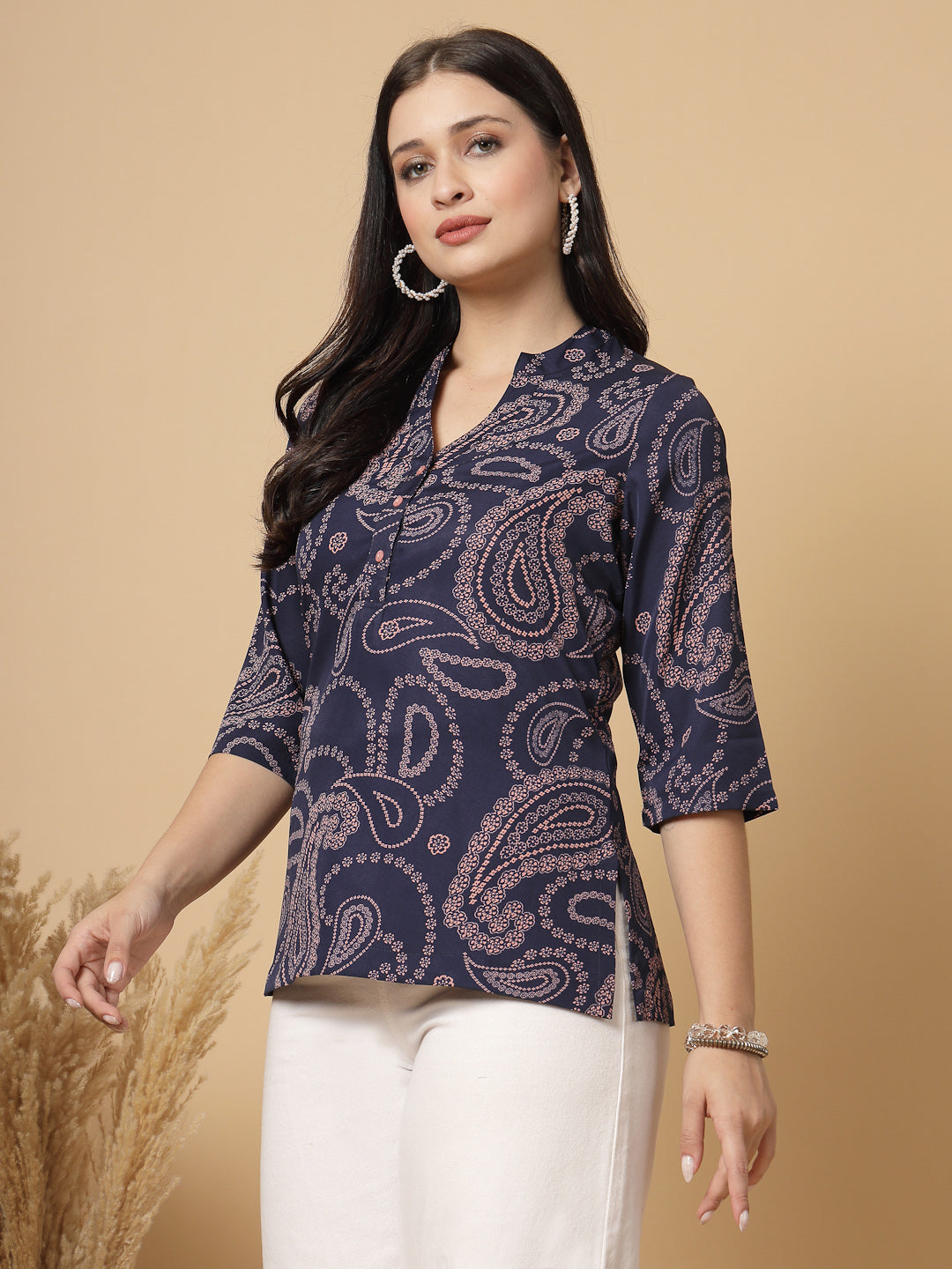 A modern take on a classic. This hip-length Printed kurta top offers a band collar, button-front, and a breezy, loose silhouette. Perfect, for office &amp; casual outings.

Dress it up or down for any occasion.
