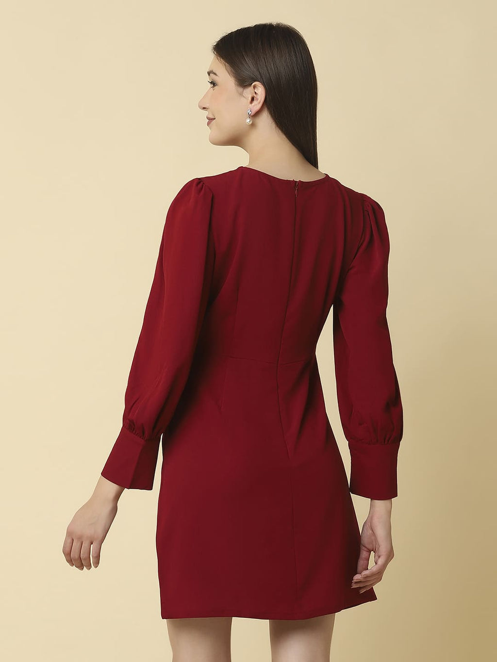 Woman wearing Raassio maroon ruched short dress with long puff sleeves facing back View