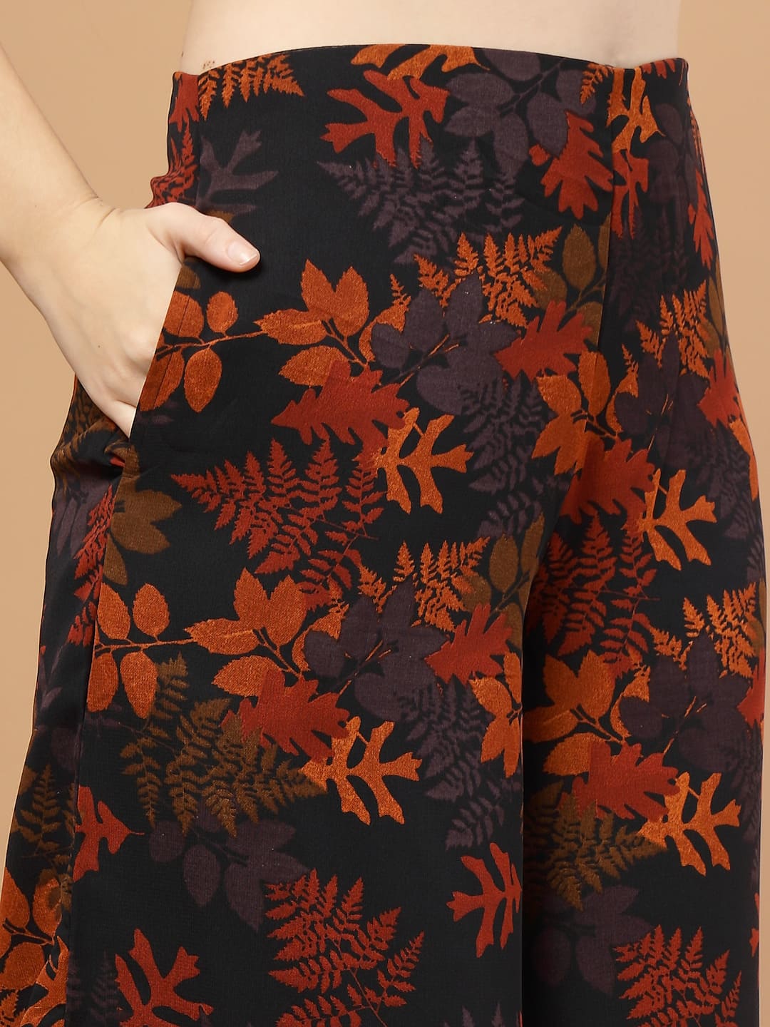 Tropical printed layered kurta set with flared pants for women – festive wear with lace detailing, side zip, lining, and pocket, pant close up.