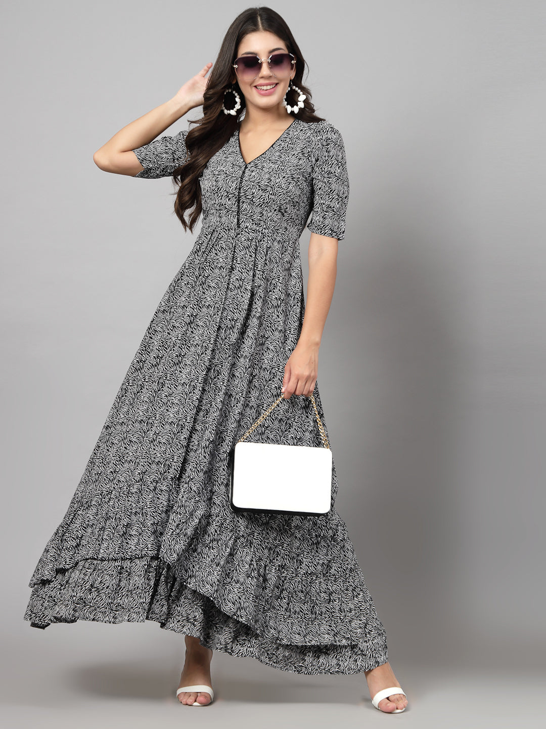 Printed Dress in for women & girls Crepe.  Tailored With Short Sleeve & 'V' Neck, has a high low double layer pattern at front.  Finished with a zip Closure at back for easy slip in.