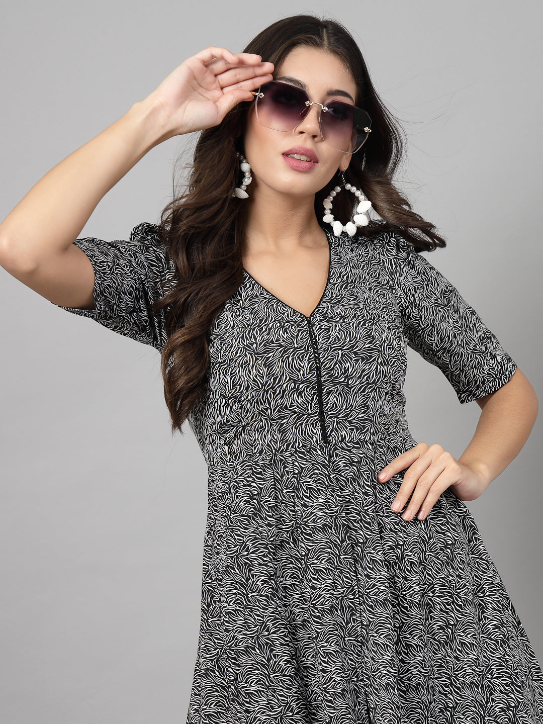 Printed Dress in for women & girls Crepe.  Tailored With Short Sleeve & 'V' Neck, has a high low double layer pattern at front.  Finished with a zip Closure at back for easy slip in.