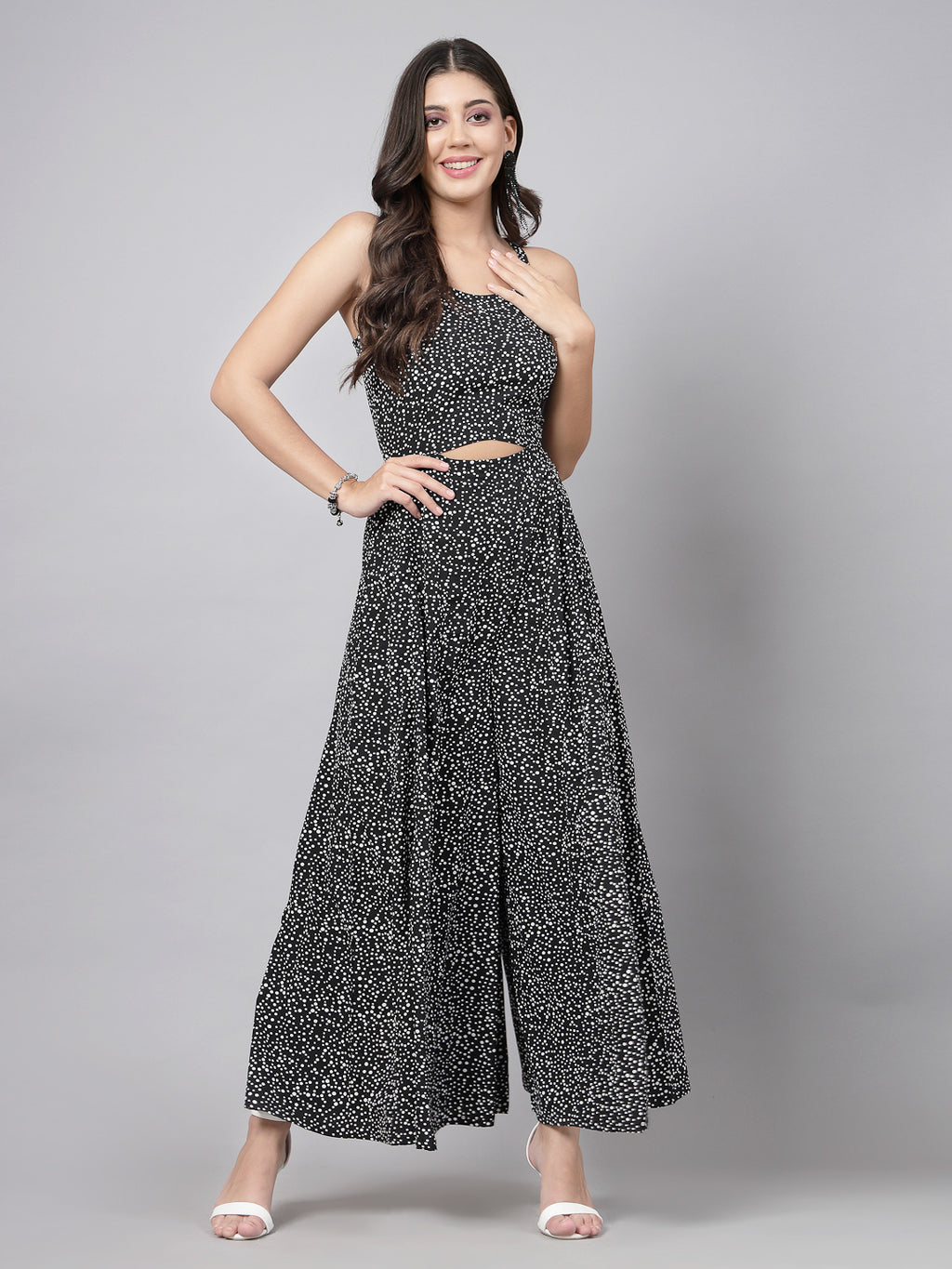 This stunning and playful tiny polka print jumpsuit for women & girls with a stylish cut at the waist is what your wardrobe just needs ! Complete your look with a pair of heels and a sling.   Colour : Black  Print : Tiny Polka Print  Material : Crepe  Sleeve : Sleeveless  Zip Closure at Back   