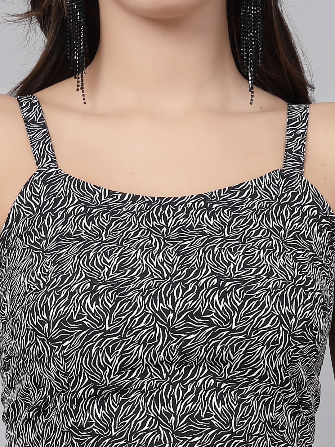 This stunning and playful black print jumpsuit for women & girls with a stylish cut at the waist is what your wardrobe just needs ! Complete your look with a pair of heels and a sling.   Colour : Black  Print : All over Print  Material : Crepe  Sleeve : Sleeveless  Zip Closure at Back