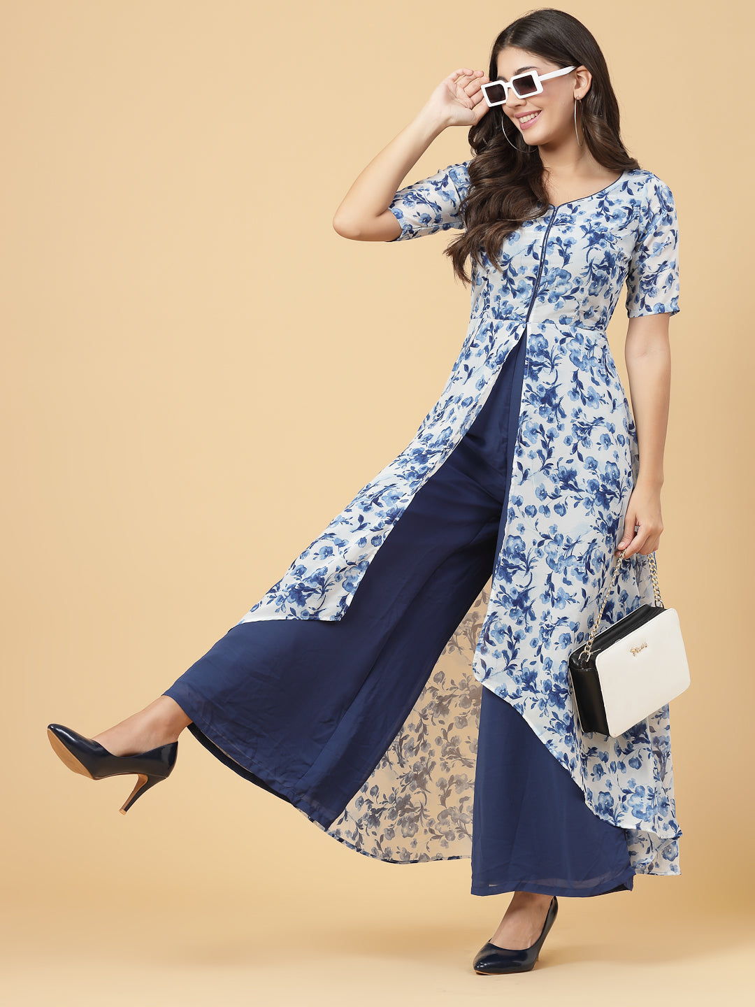 Make a stylish statement by this all time favourite jumpsuit for women, whether its official meetings or family gatherings, this will surly turn heads.  Zip Closure at Back | Fabric Crepe | Lining attached