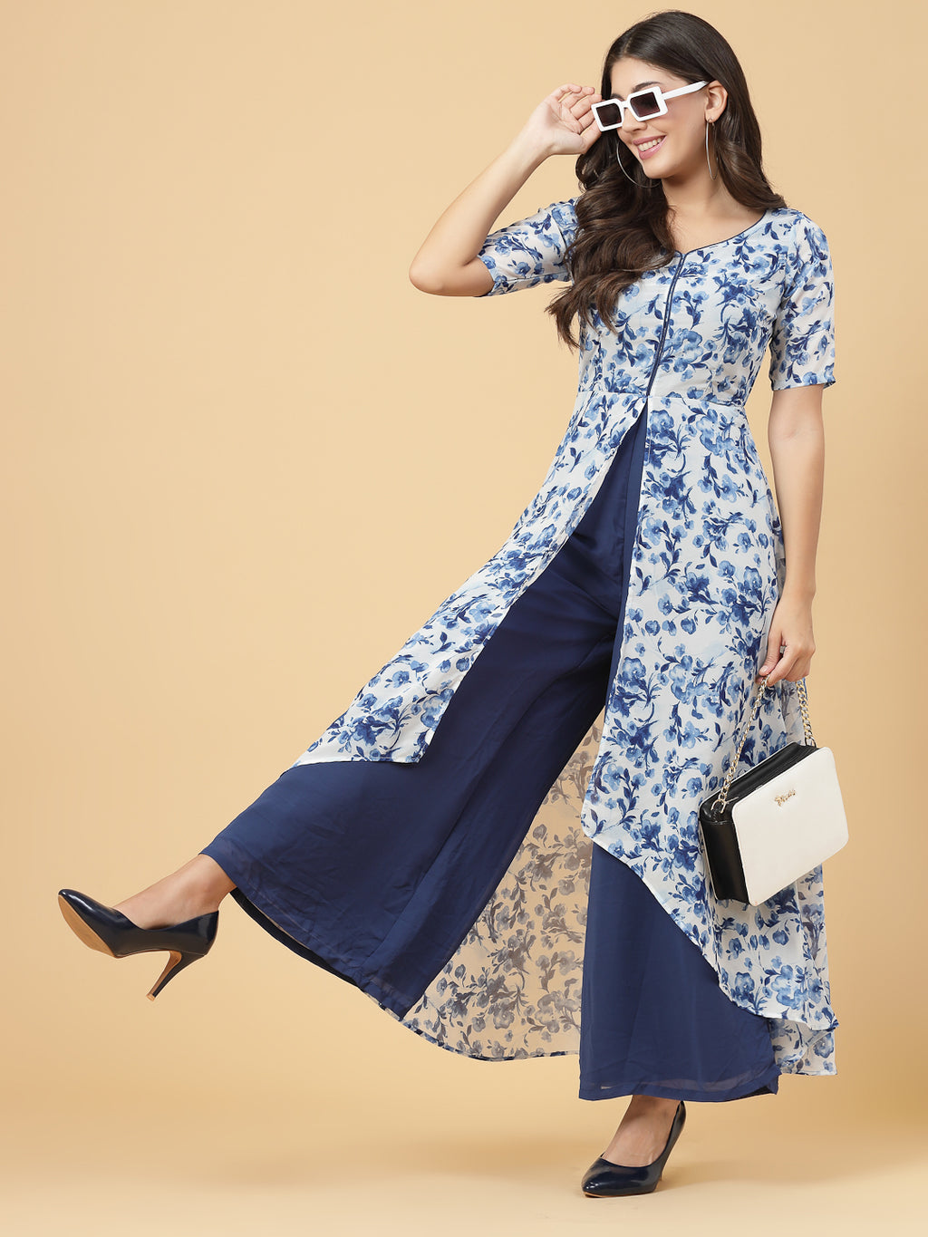 Make a stylish statement by this all time favourite jumpsuit for women, whether its official meetings or family gatherings, this will surly turn heads.  Zip Closure at Back | Fabric Crepe | Lining attached
