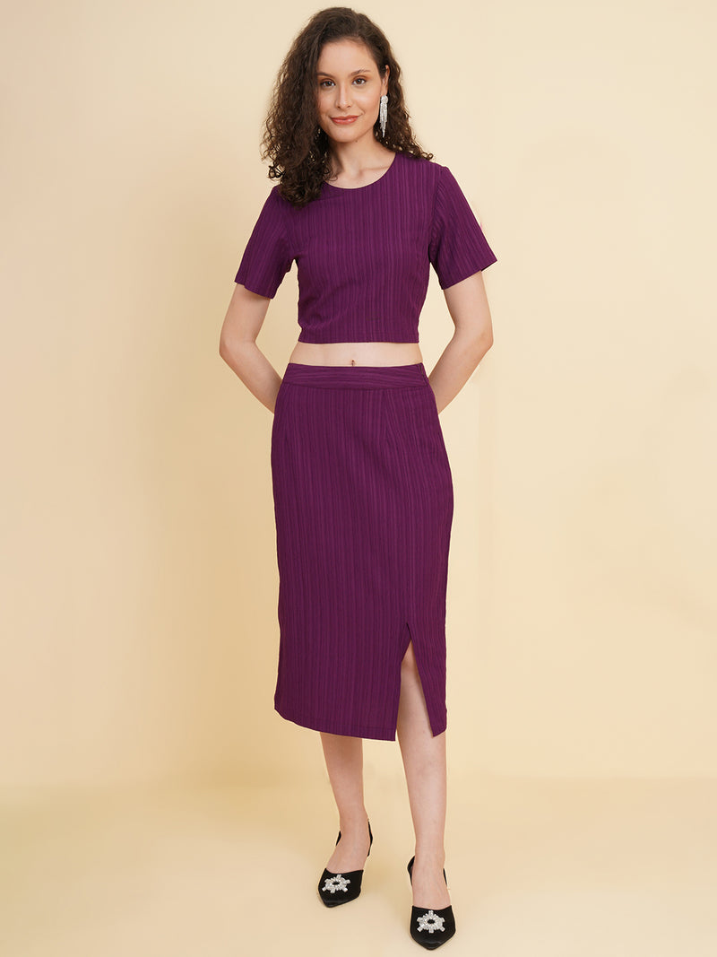 Unleash your inner fashionista with our stunning purple stretchable co-ord set!  Featuring a trendy crop top and a sleek straight skirt.   Colour: Purple Material: Polyester Neck: Round with Keyhole at back Sleeve: Short Top Closure: Button Skirt Closure: Zip