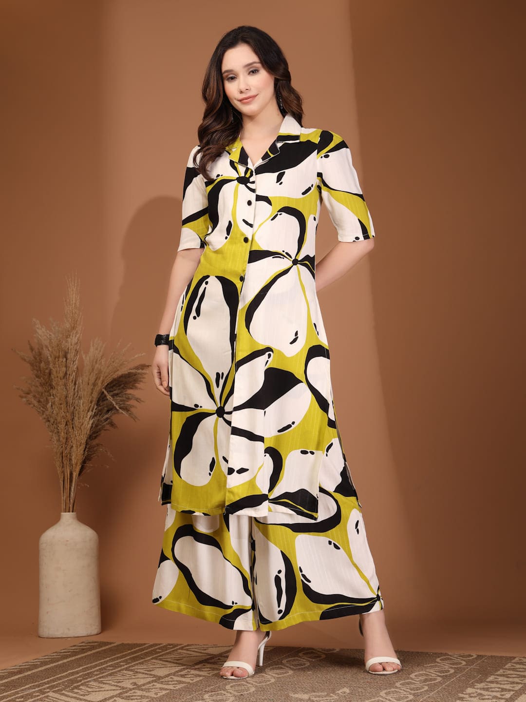Woman wearing RAASSIO lime green abstract printed 100% viscose front slit kurta set with palazzo pants front view