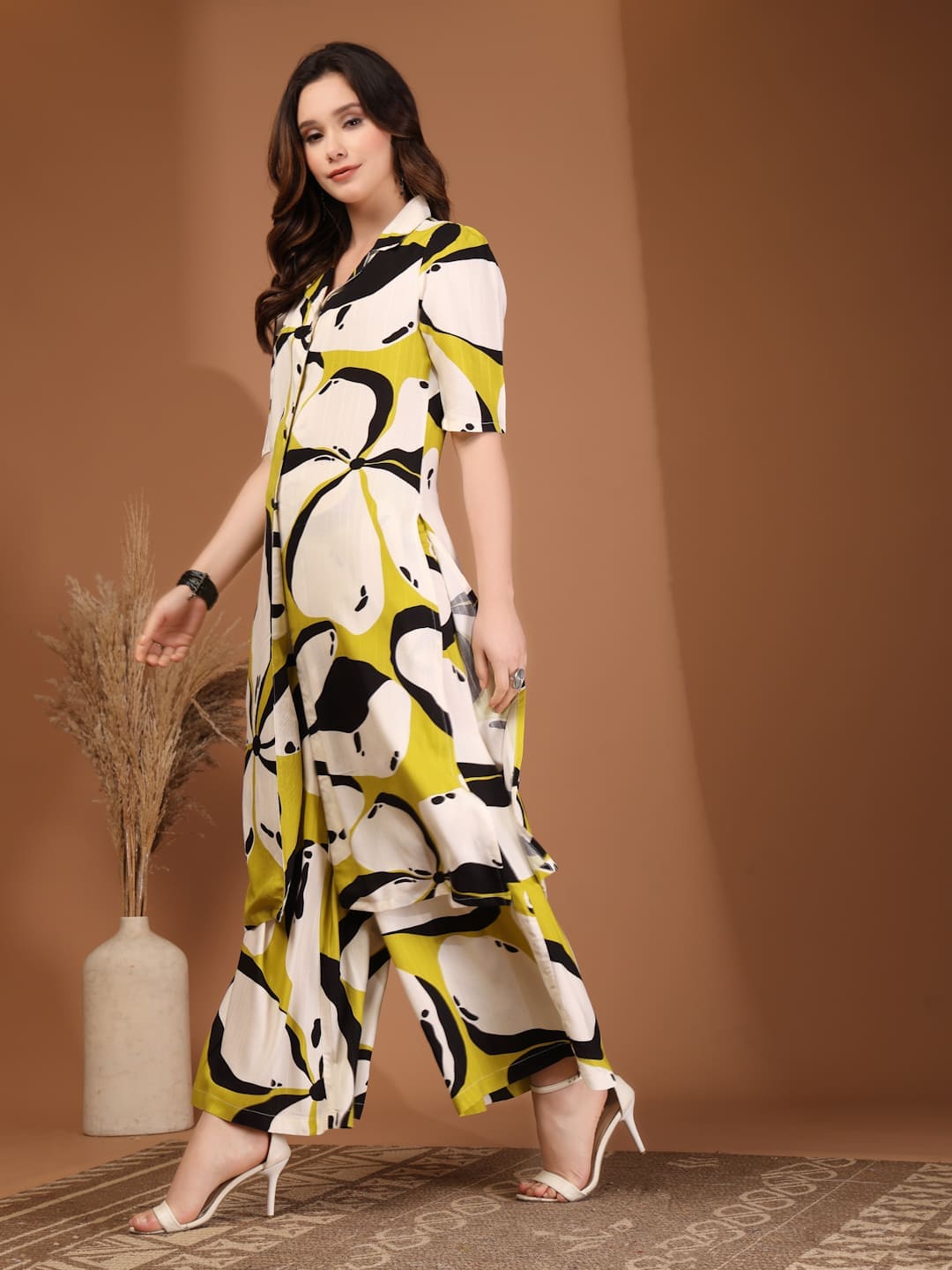Woman wearing RAASSIO lime green abstract printed 100% viscose front slit kurta set with palazzo pants side view