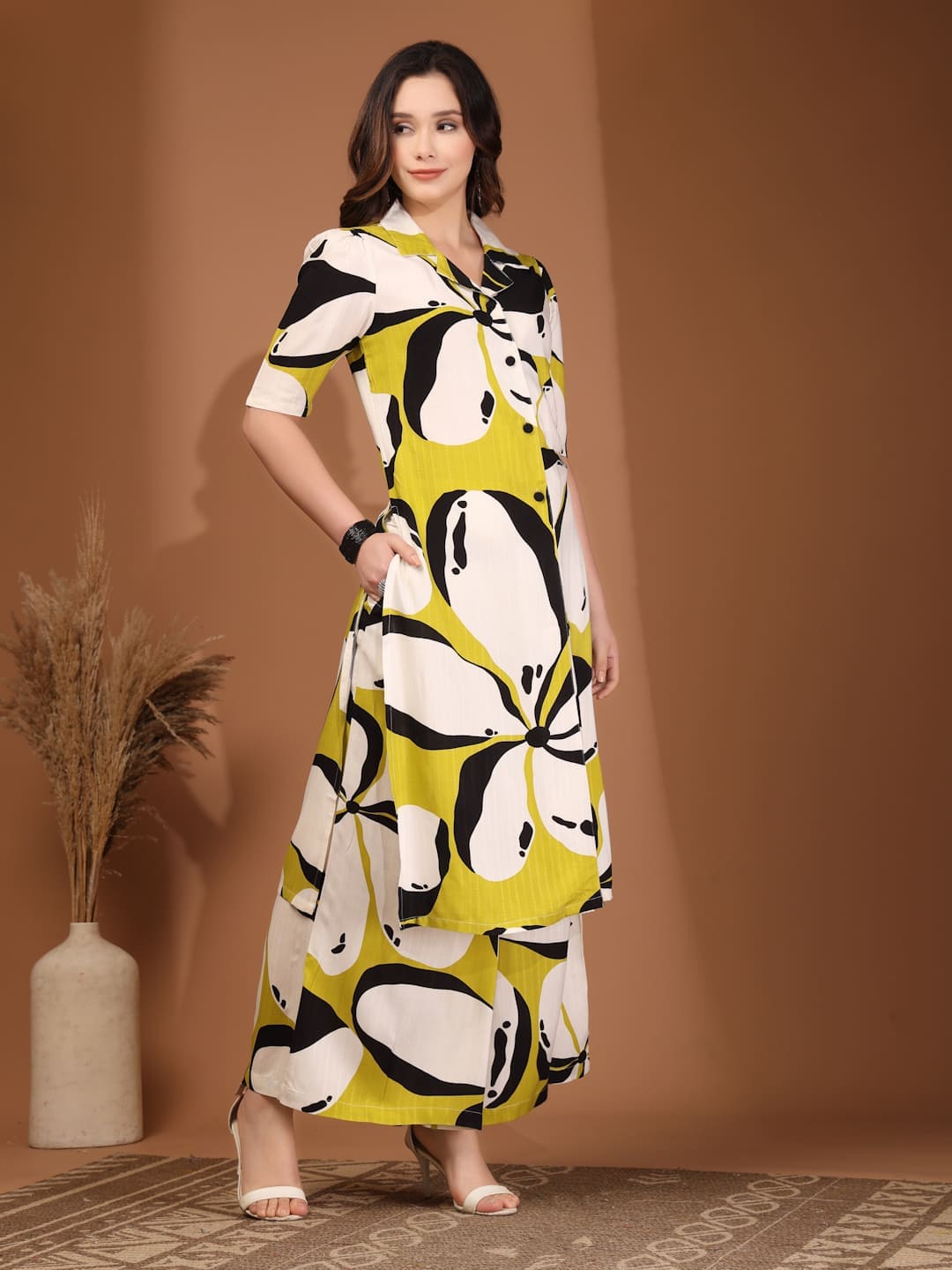 Woman wearing RAASSIO lime green abstract printed 100% viscose front slit kurta set with palazzo pants right side view
