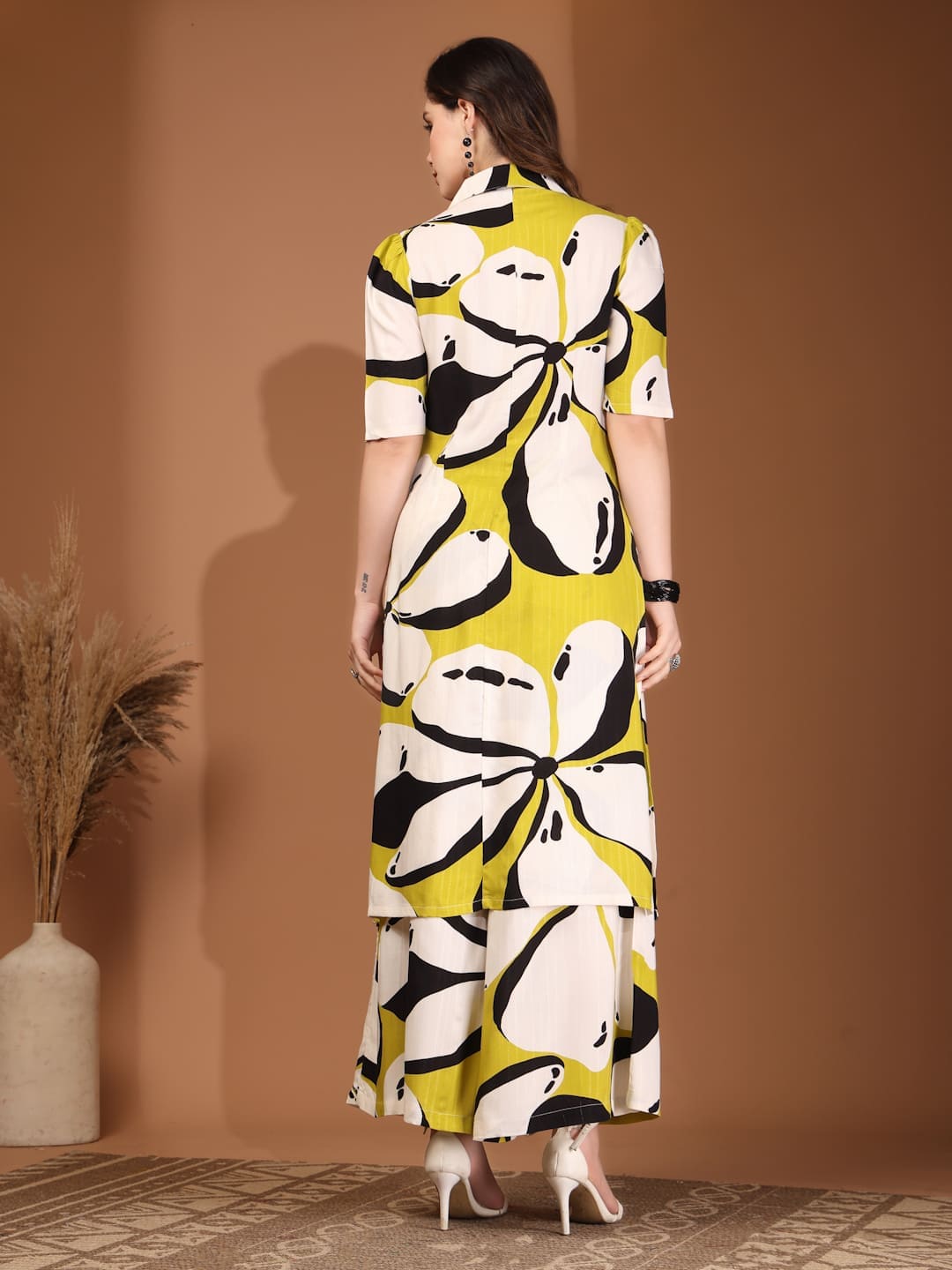 Woman wearing RAASSIO lime green abstract printed 100% viscose front slit kurta set with palazzo pants back view