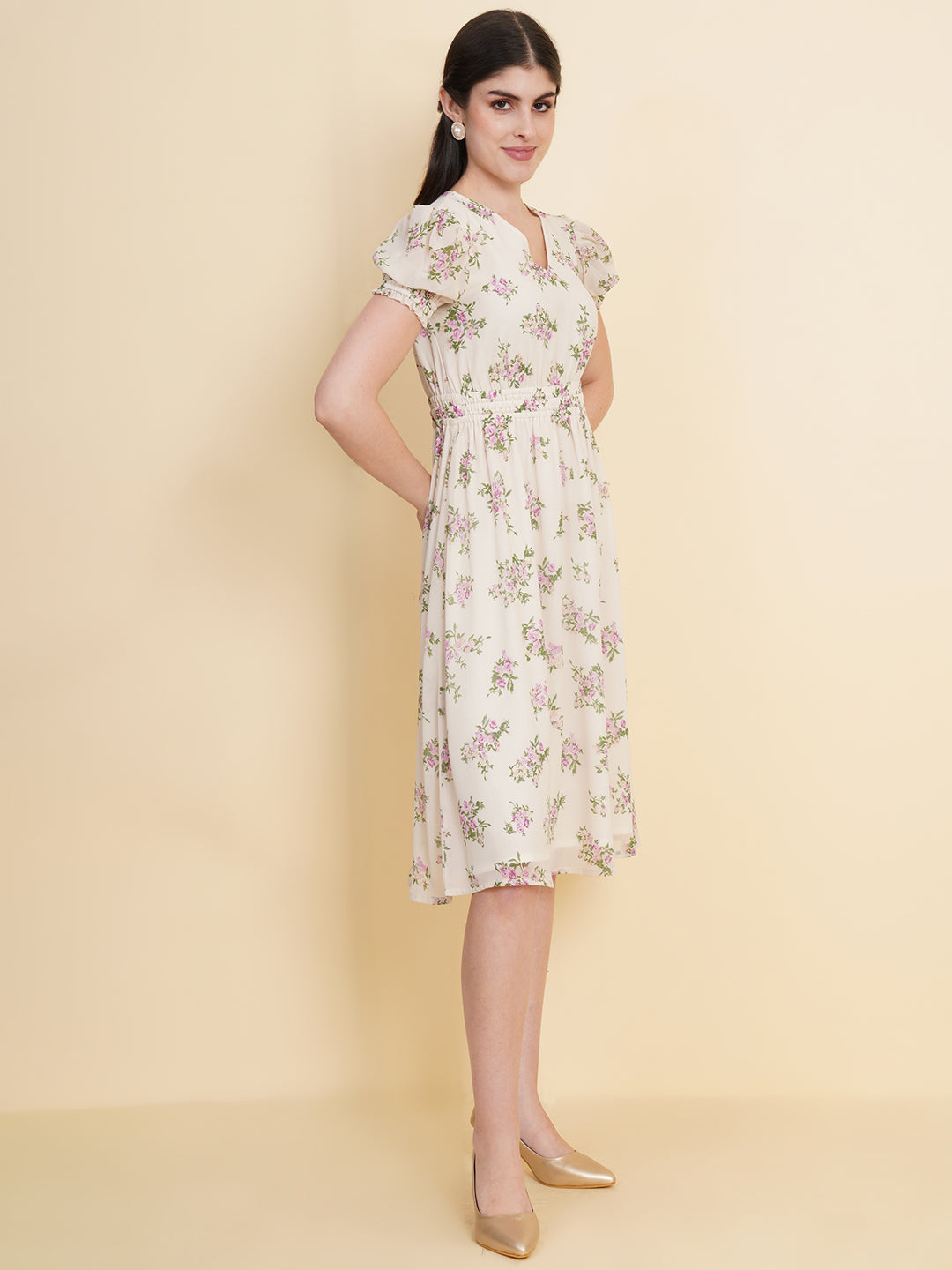 Slay the season in this refreshing cream print ruched waist dress for women. Tailored in a flowy silhouette, the dress features a floral print with attached lining and ruched detail on the waist.  Style Tip: Enhance your look with strappy sandals and a white sling bag.