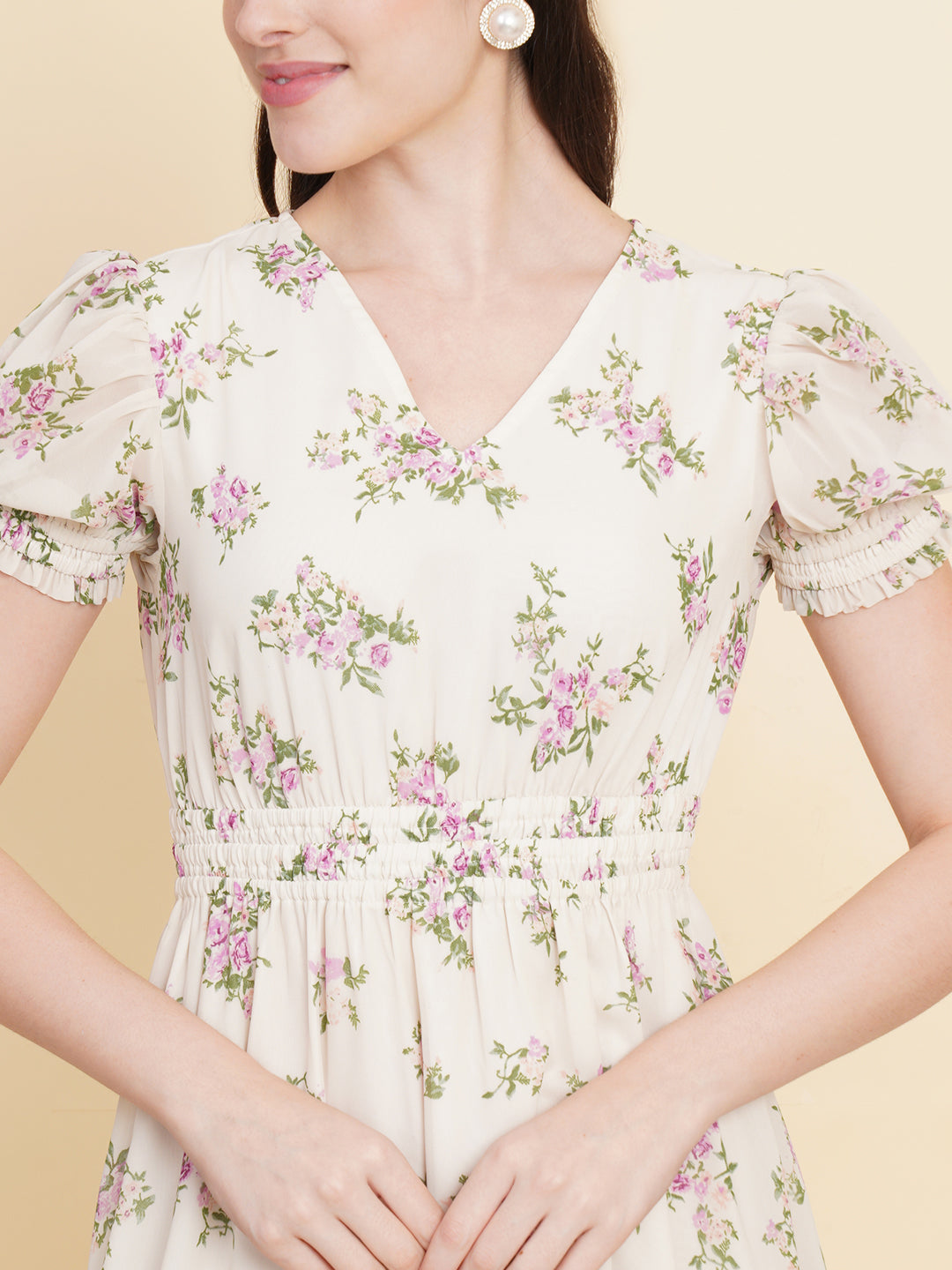 Slay the season in this refreshing cream print ruched waist dress for women. Tailored in a flowy silhouette, the dress features a floral print with attached lining and ruched detail on the waist.  Style Tip: Enhance your look with strappy sandals and a white sling bag.