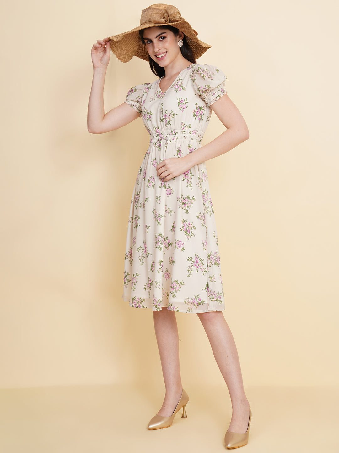 Slay the season in this refreshing cream print ruched waist dress for women. Tailored in a flowy silhouette, the dress features a floral print with attached lining and ruched detail on the waist.  Style Tip: Enhance your look with strappy sandals and a white sling bag.