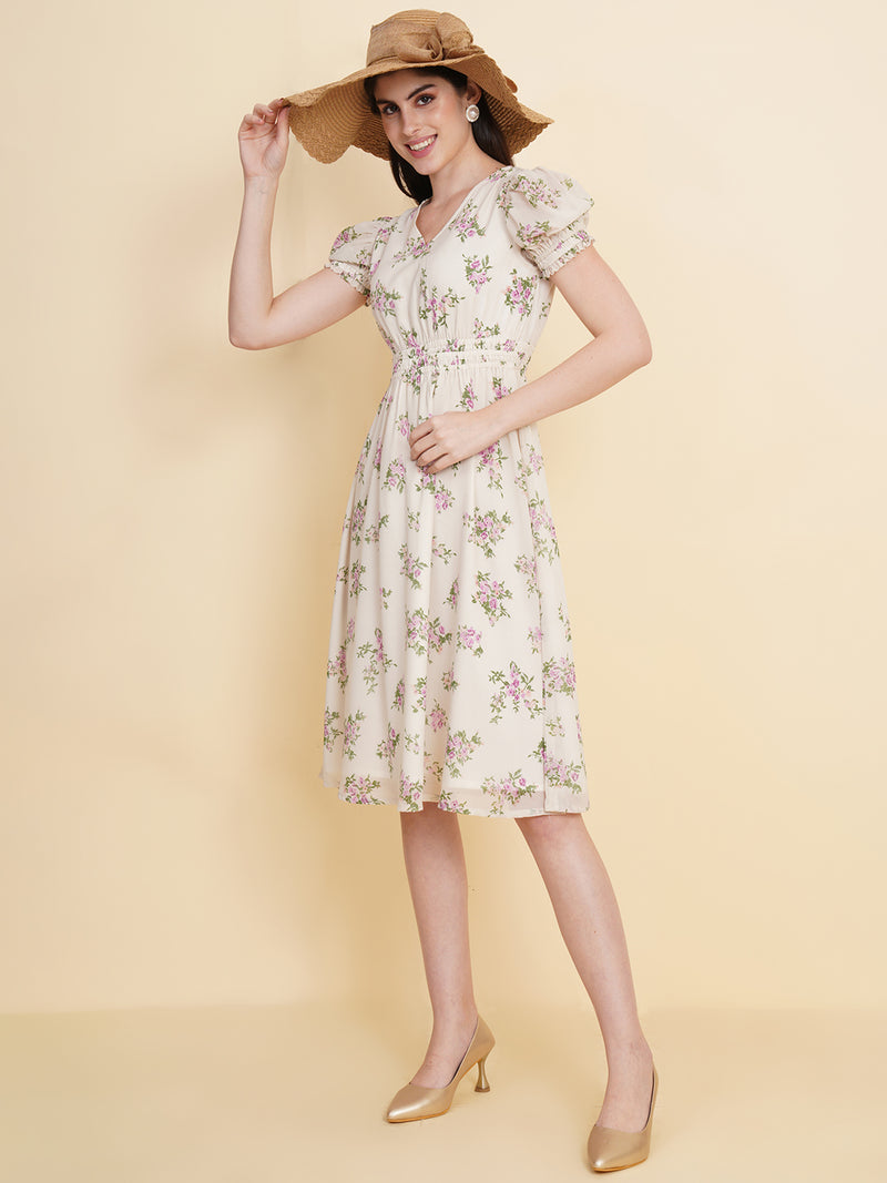 Slay the season in this refreshing cream print ruched waist dress for women. Tailored in a flowy silhouette, the dress features a floral print with attached lining and ruched detail on the waist.  Style Tip: Enhance your look with strappy sandals and a white sling bag.