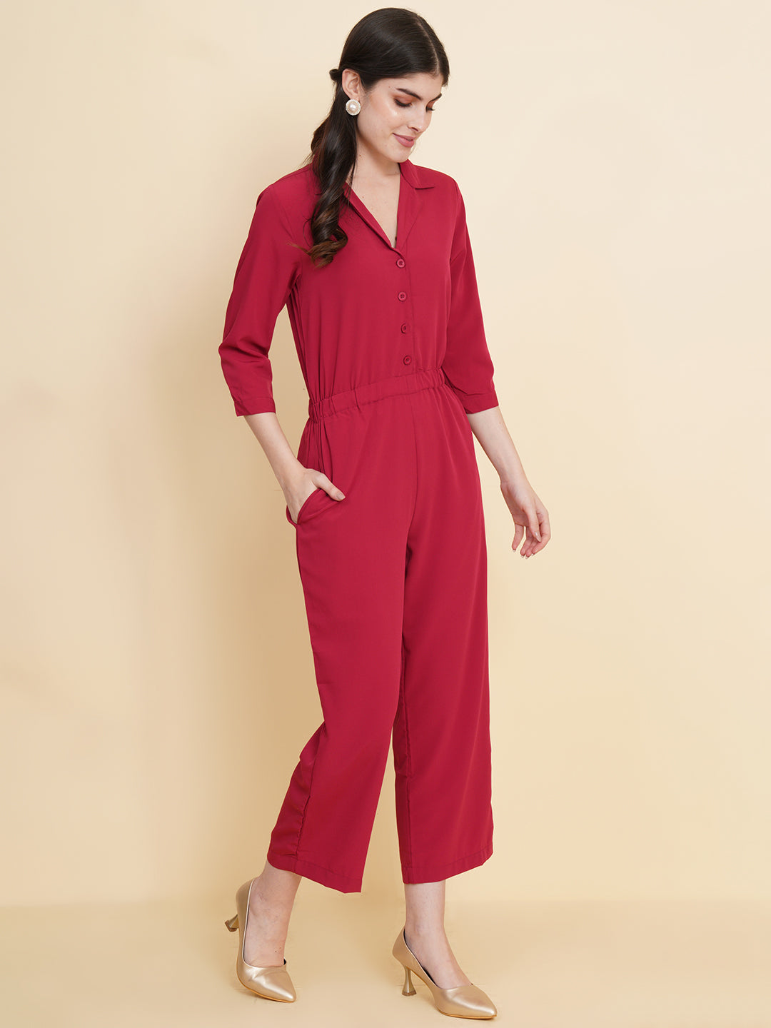 Get ready to make a bold statement with our black formal jumpsuit for women! Tailored in crepe, it features a coat collar with front buttoning and elasticated waist and two side pockets to slip in your essentials. This elegant piece combines sleekness and sophistication, perfect for official and casual wear.